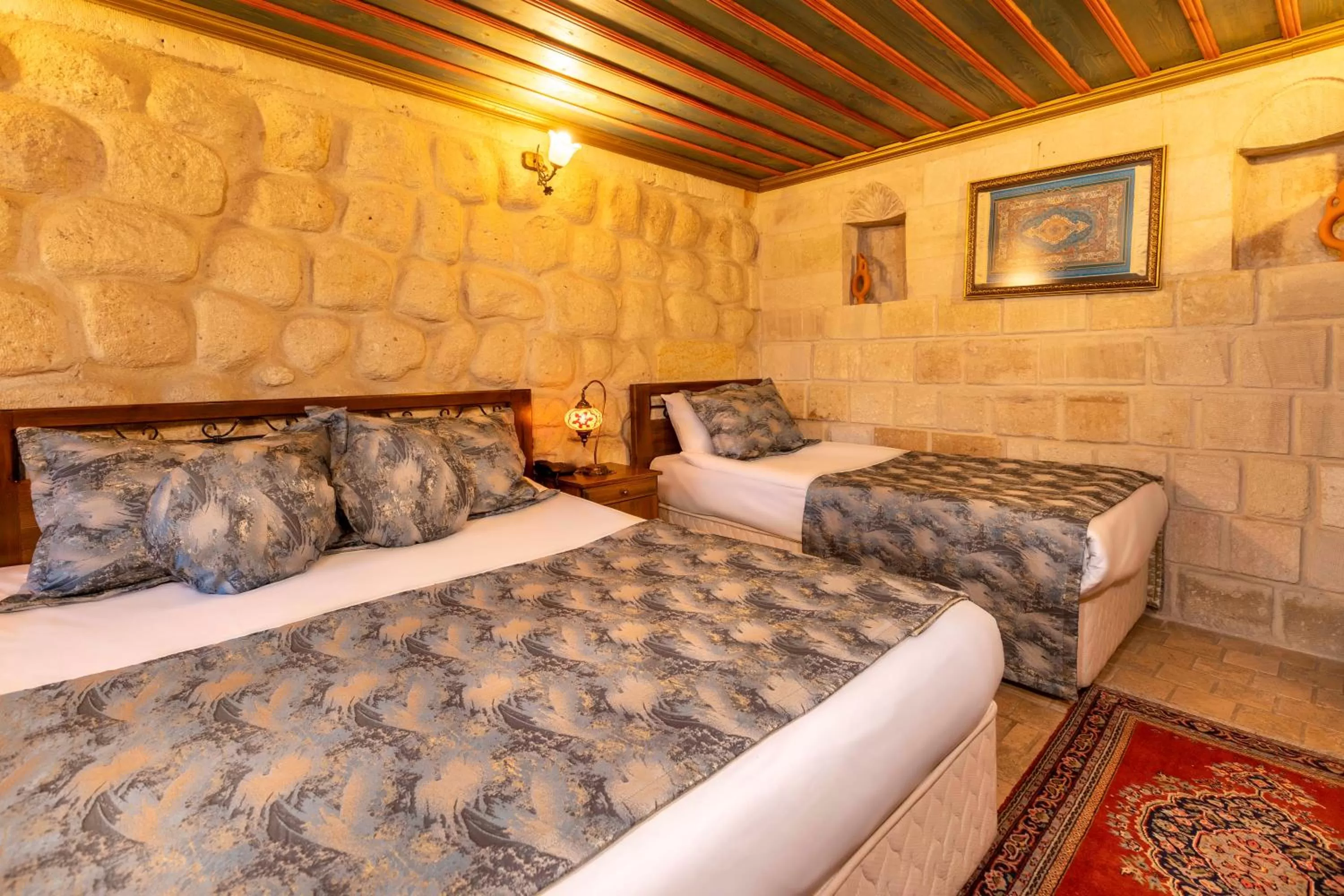 Bed in Adora Cave Suites -