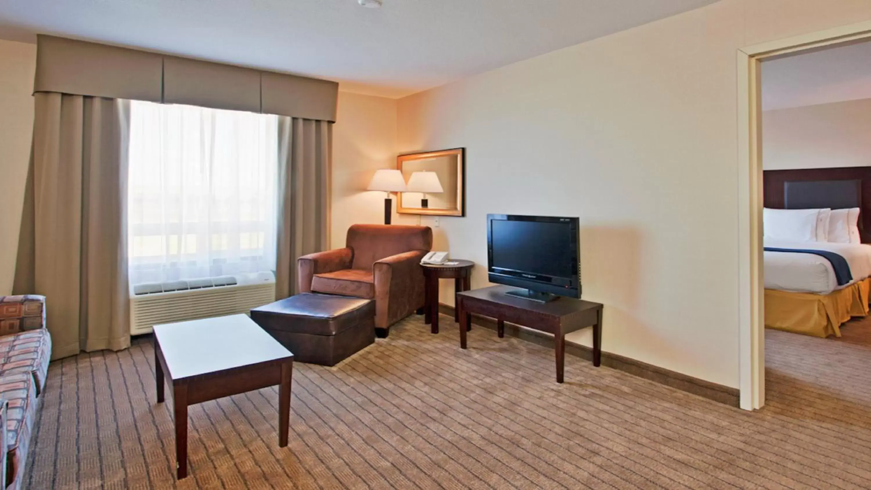 Photo of the whole room, TV/Entertainment Center in Holiday Inn Express Hotel & Suites Swift Current, an IHG Hotel