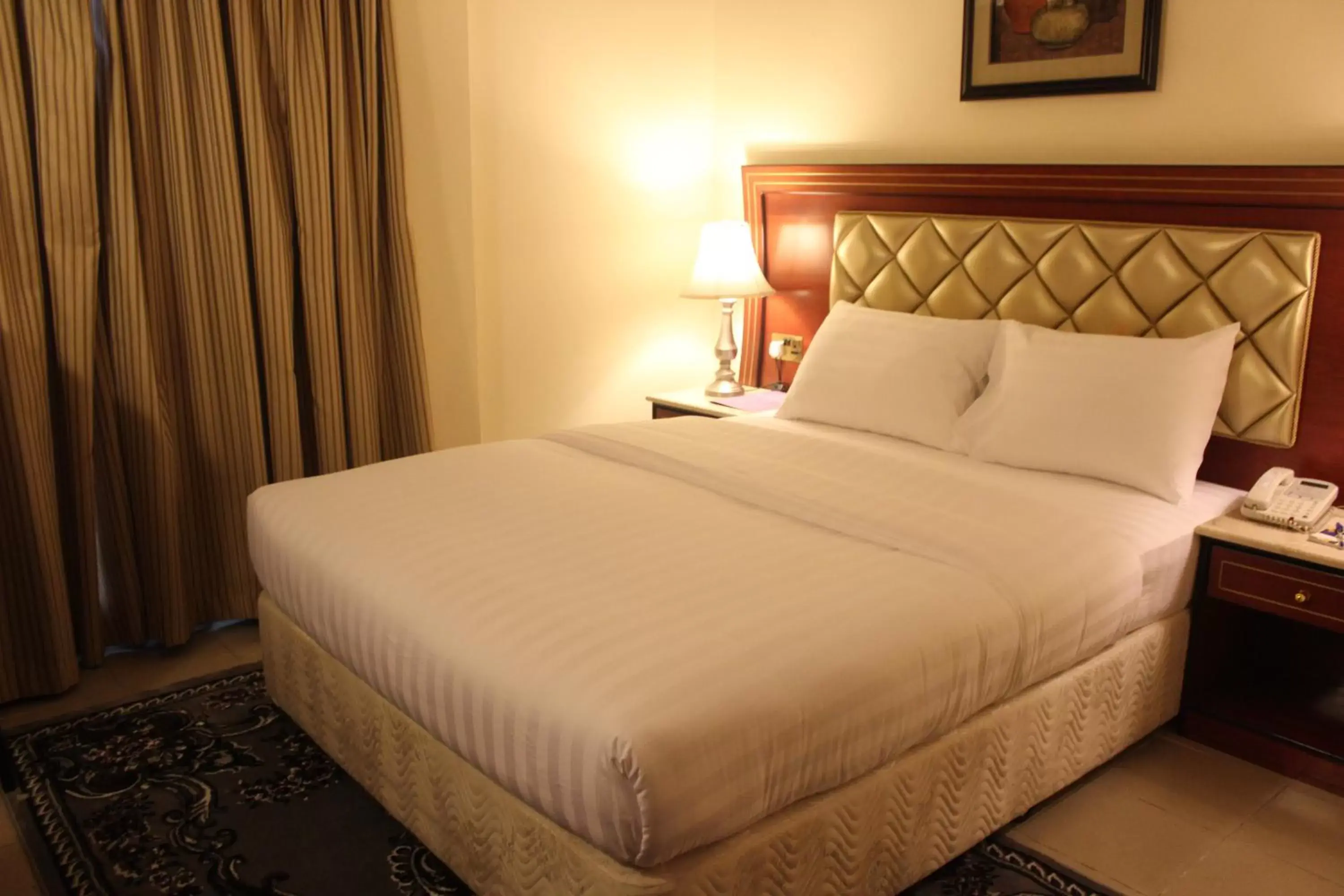 Bed in Saffron Hotel
