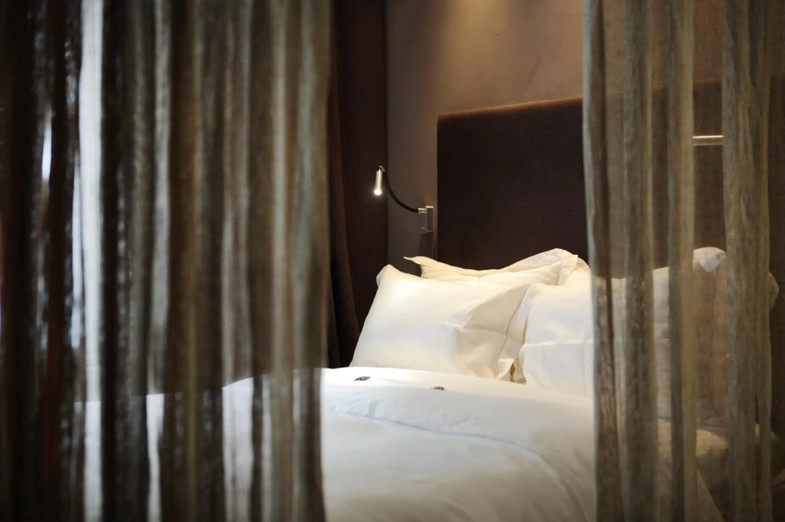 Bed in Hidden Hotel