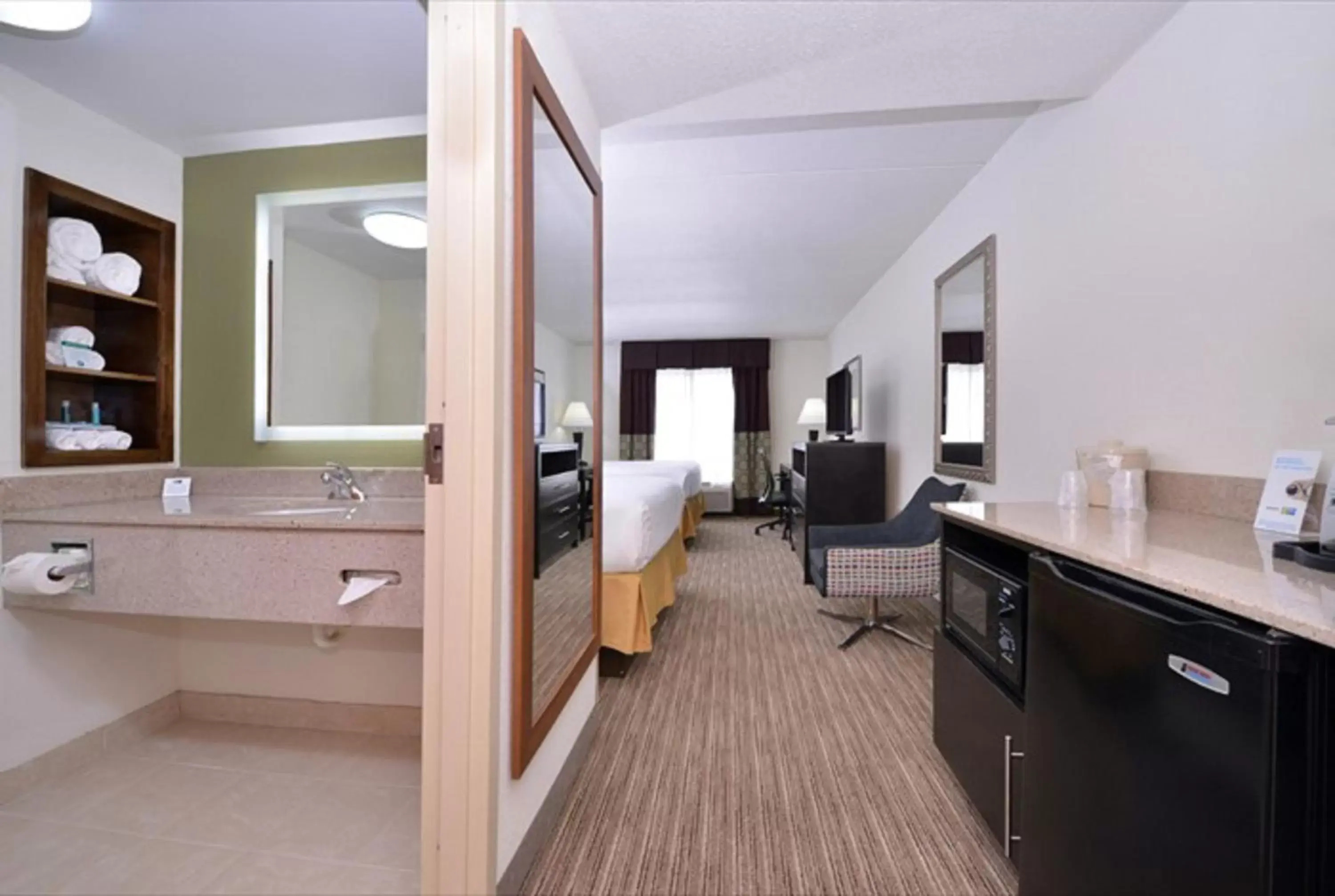 Photo of the whole room, TV/Entertainment Center in Holiday Inn Express Hotel & Suites Mooresville - Lake Norman, an IHG Hotel