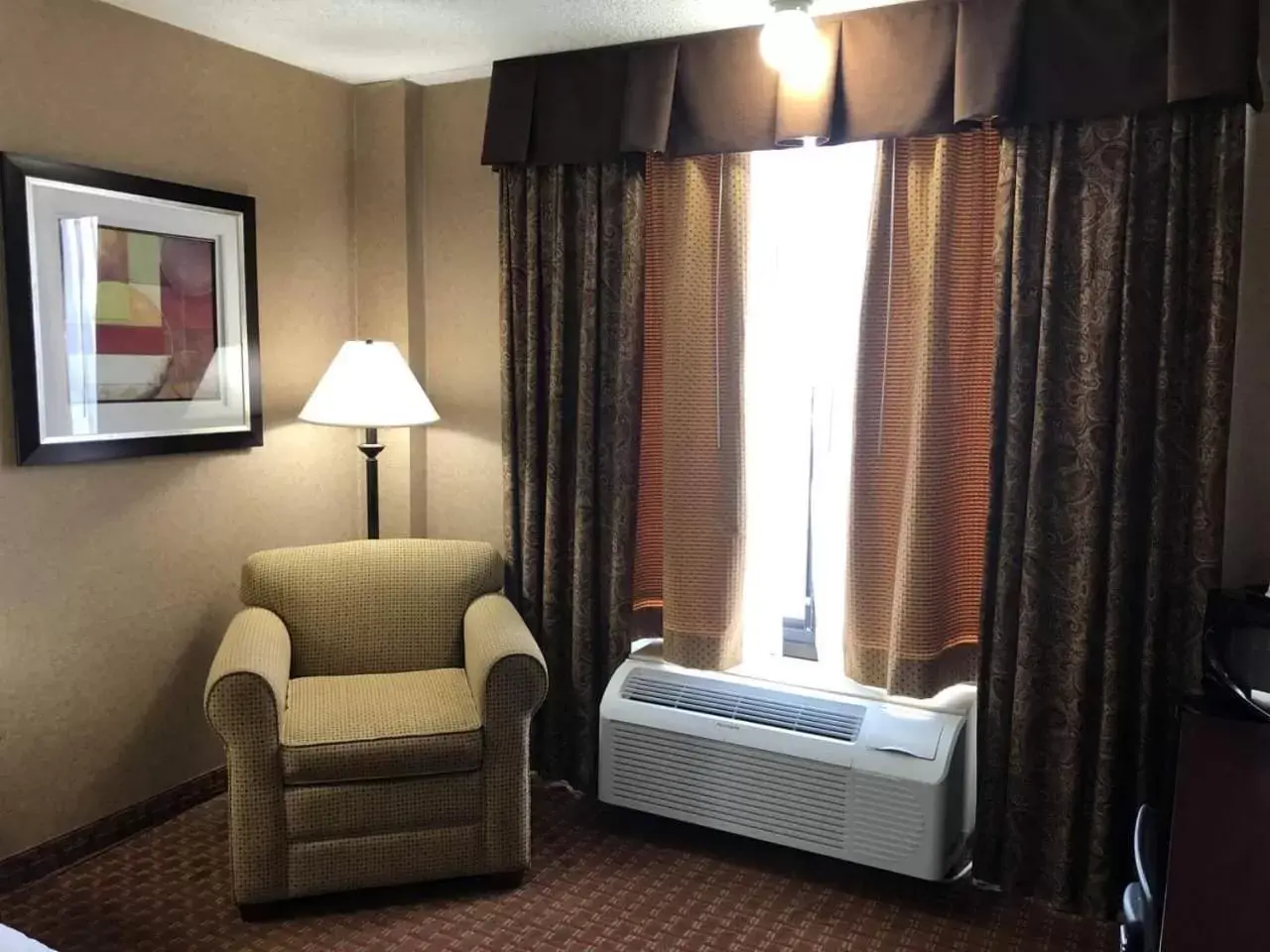 Seating area, Bed in AmericInn by Wyndham Casper Event Center Area Seating area, Bed in AmericInn by Wyndham Casper Event Center Area