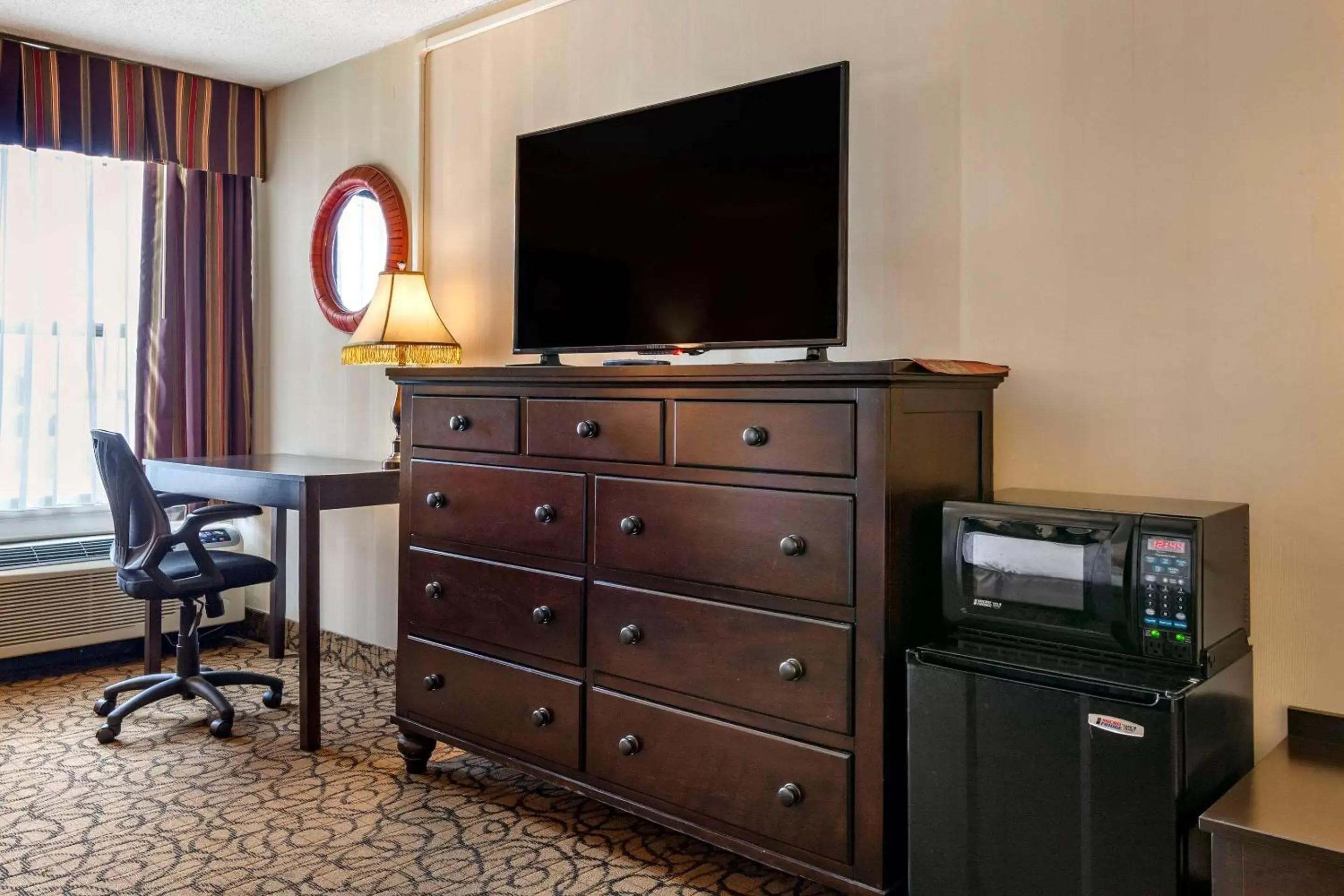 Photo of the whole room, TV/Entertainment Center in Quality Inn & Suites