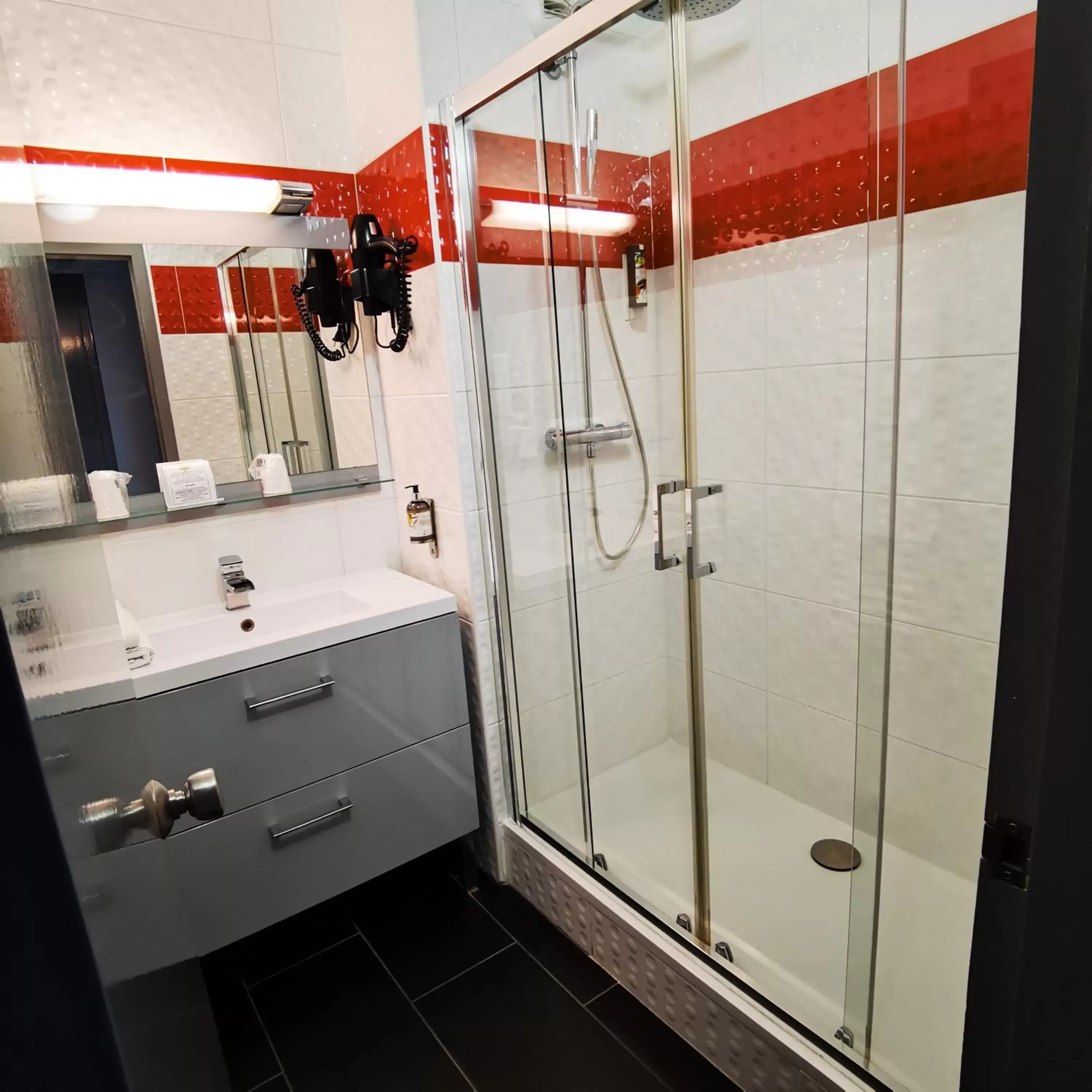 Shower, Bathroom in Logis Hotel Restaurant Black and Green Limoges Sud