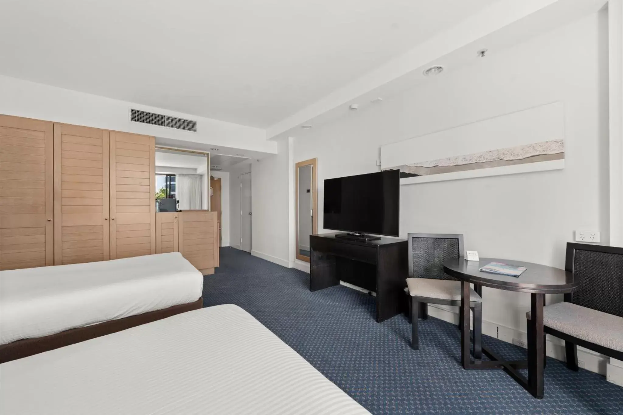 Photo of the whole room, TV/Entertainment Center in Crowne Plaza Surfers Paradise, an IHG Hotel