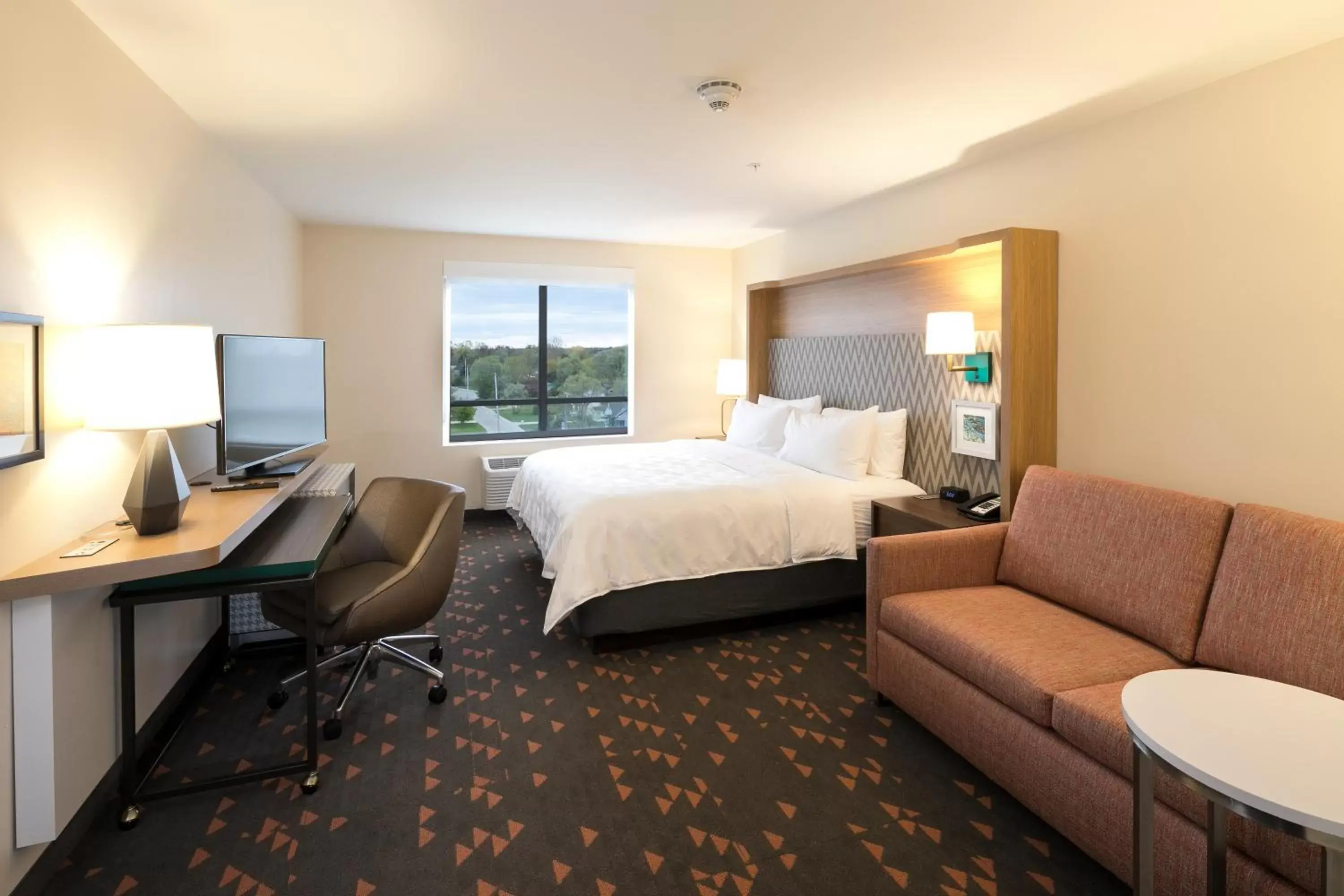 Bed in Holiday Inn & Suites Detroit - Troy, an IHG Hotel