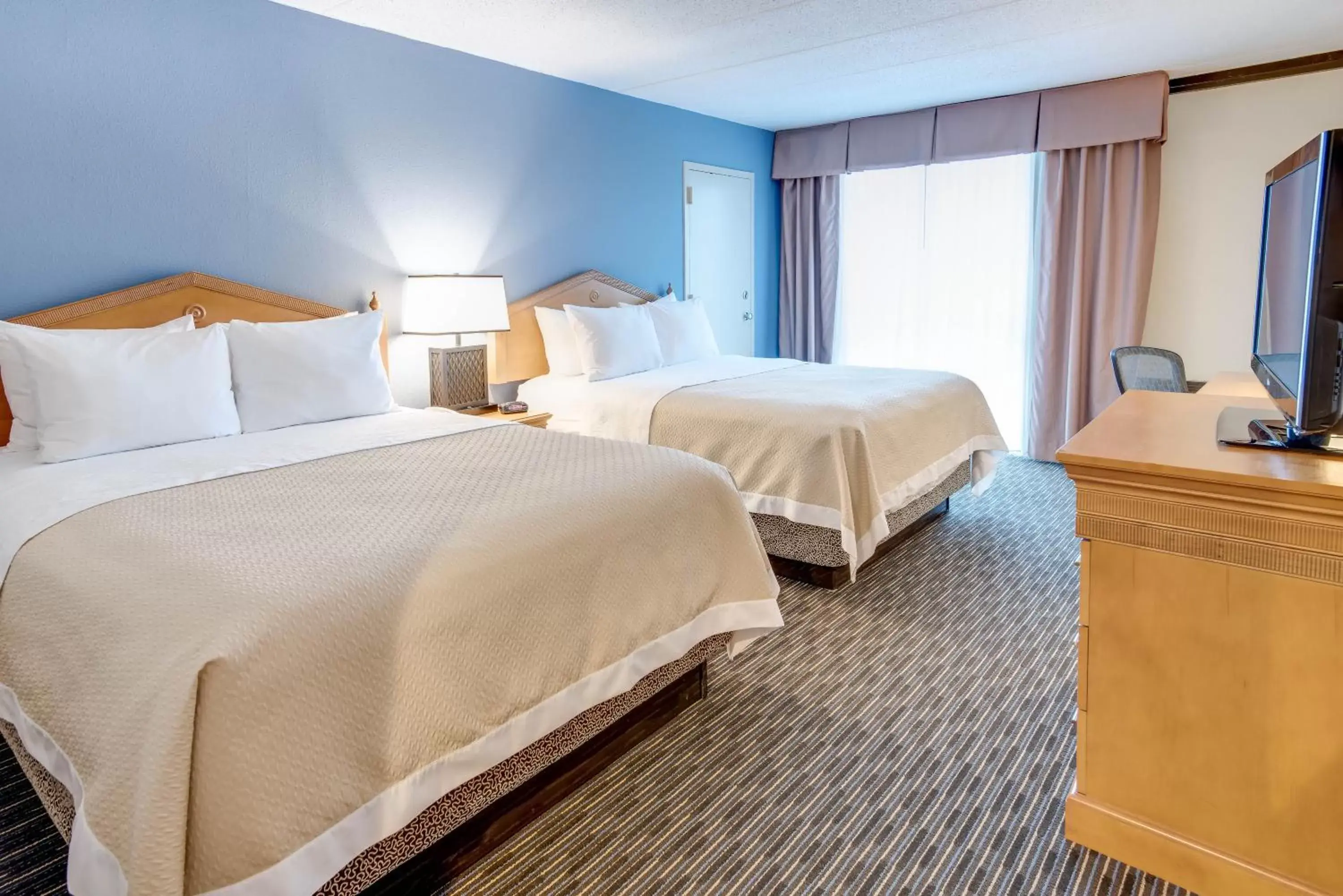 Deluxe Queen Room with Two Queen Beds - Non-Smoking in Days Hotel by Wyndham Toms River Jersey Shore