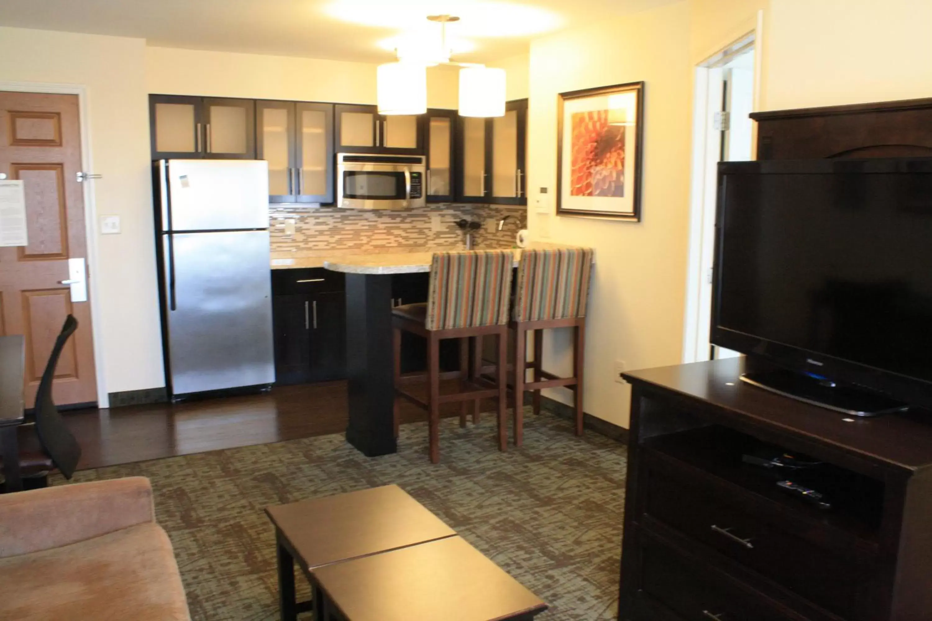 Photo of the whole room, TV/Entertainment Center in Staybridge Suites Minot, an IHG Hotel