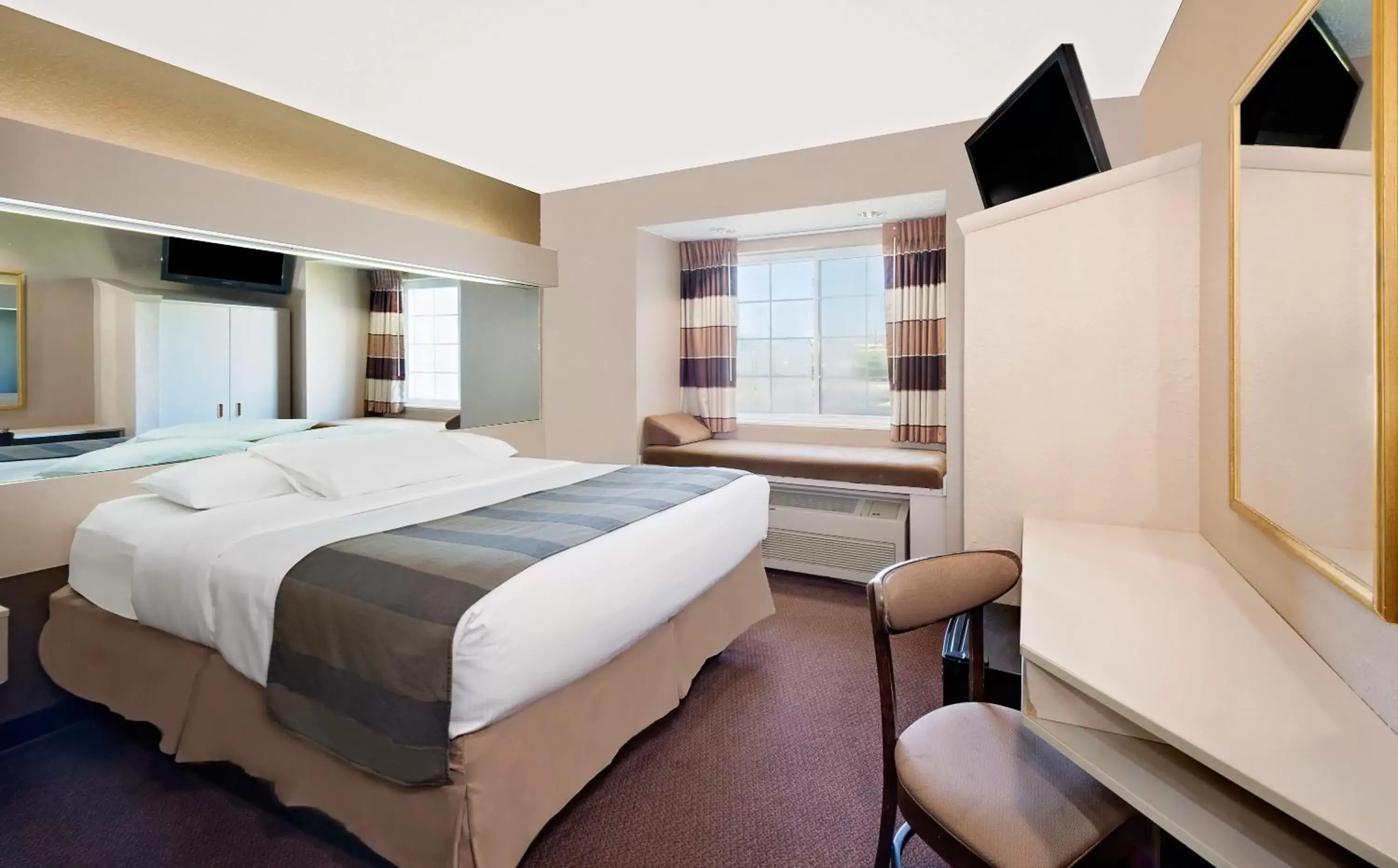 Bed in Microtel Inn & Suites by Wyndham Joplin