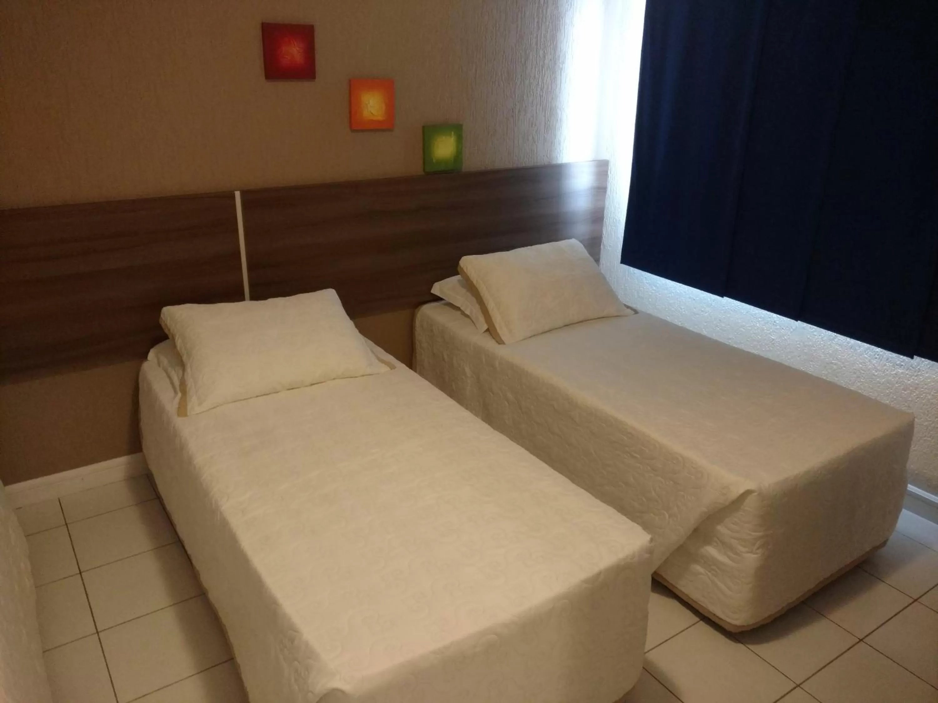 Bed in Brisamar Suite Hotel