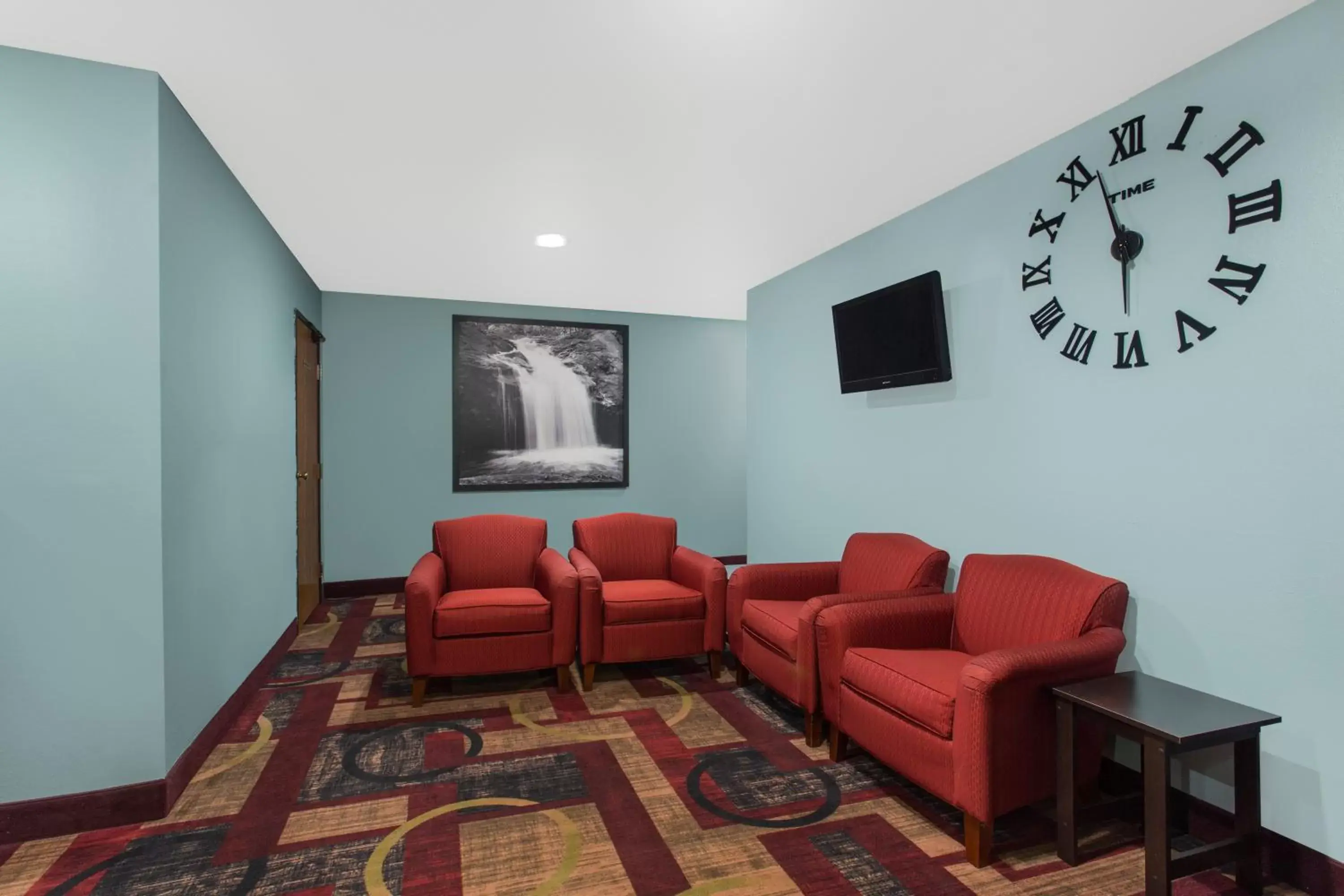 Property building, Seating Area in Super 8 by Wyndham Eau Claire I-94