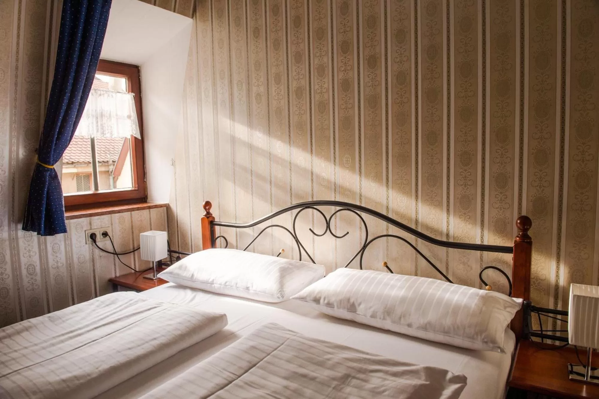 Bed in Hotel Schwarzer Adler