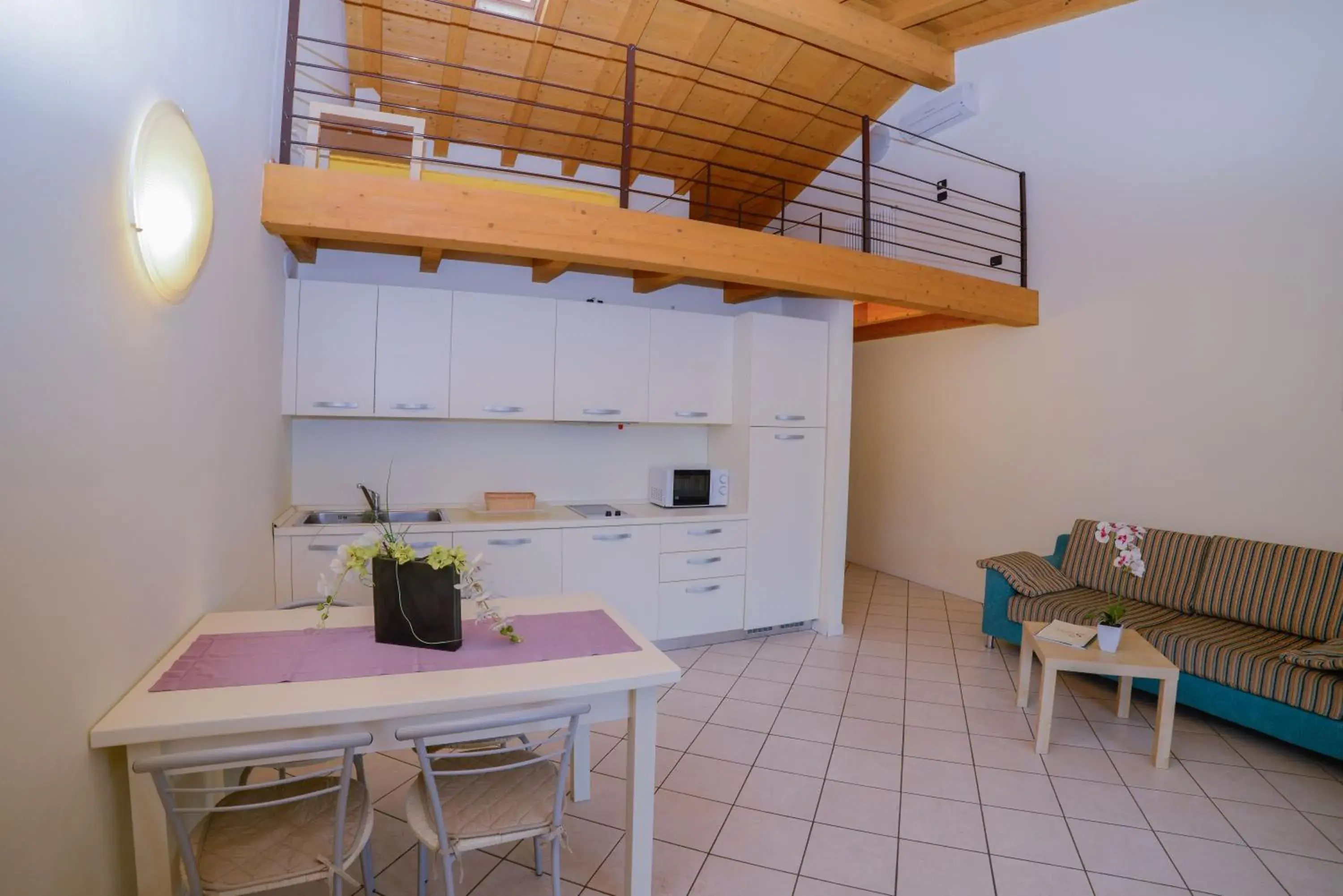 Kitchen or kitchenette, Dining Area in AHG Donna Silvia Hotel Wellness & SPA