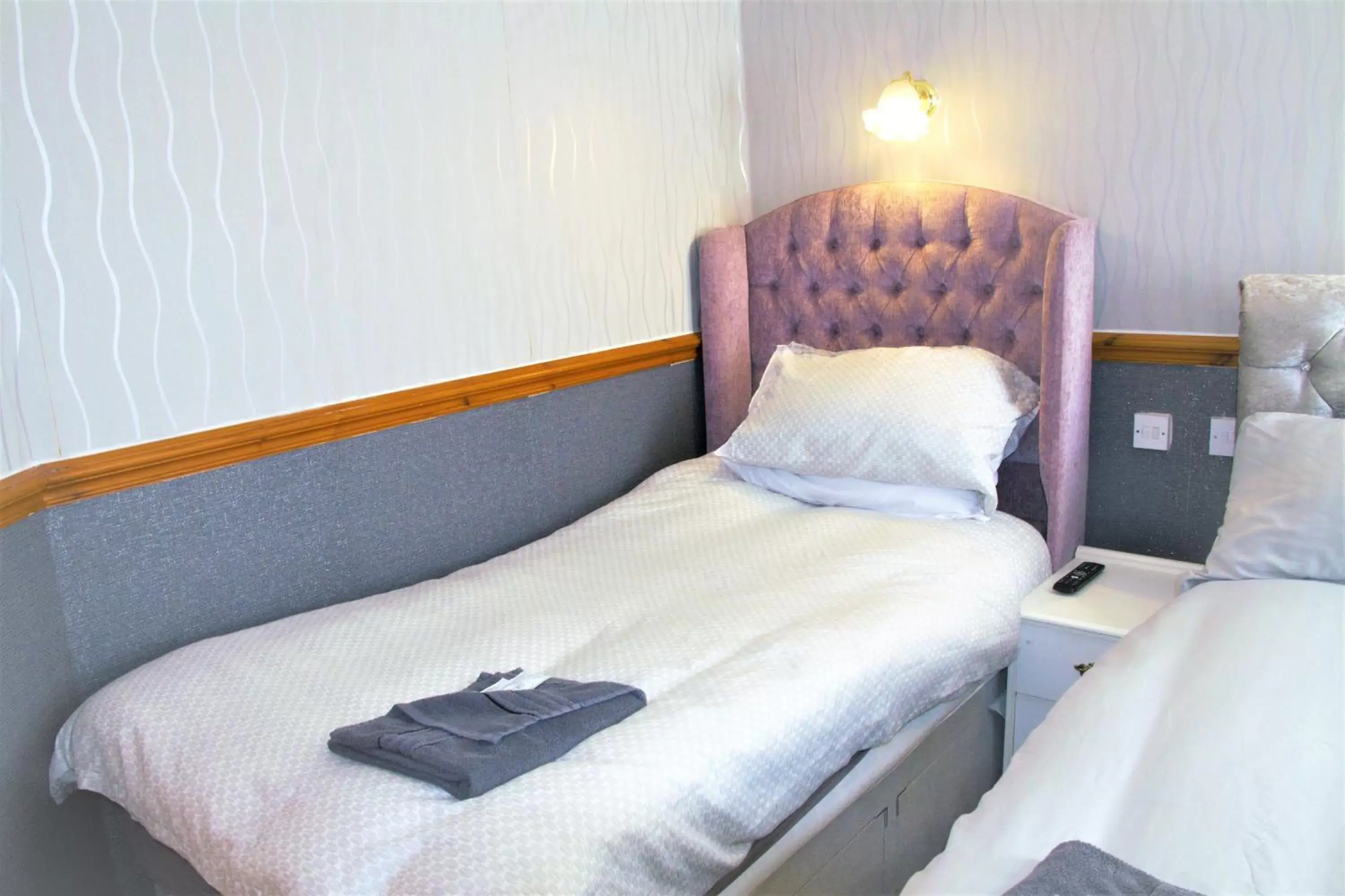 Bed in Pine Lodge Hotel