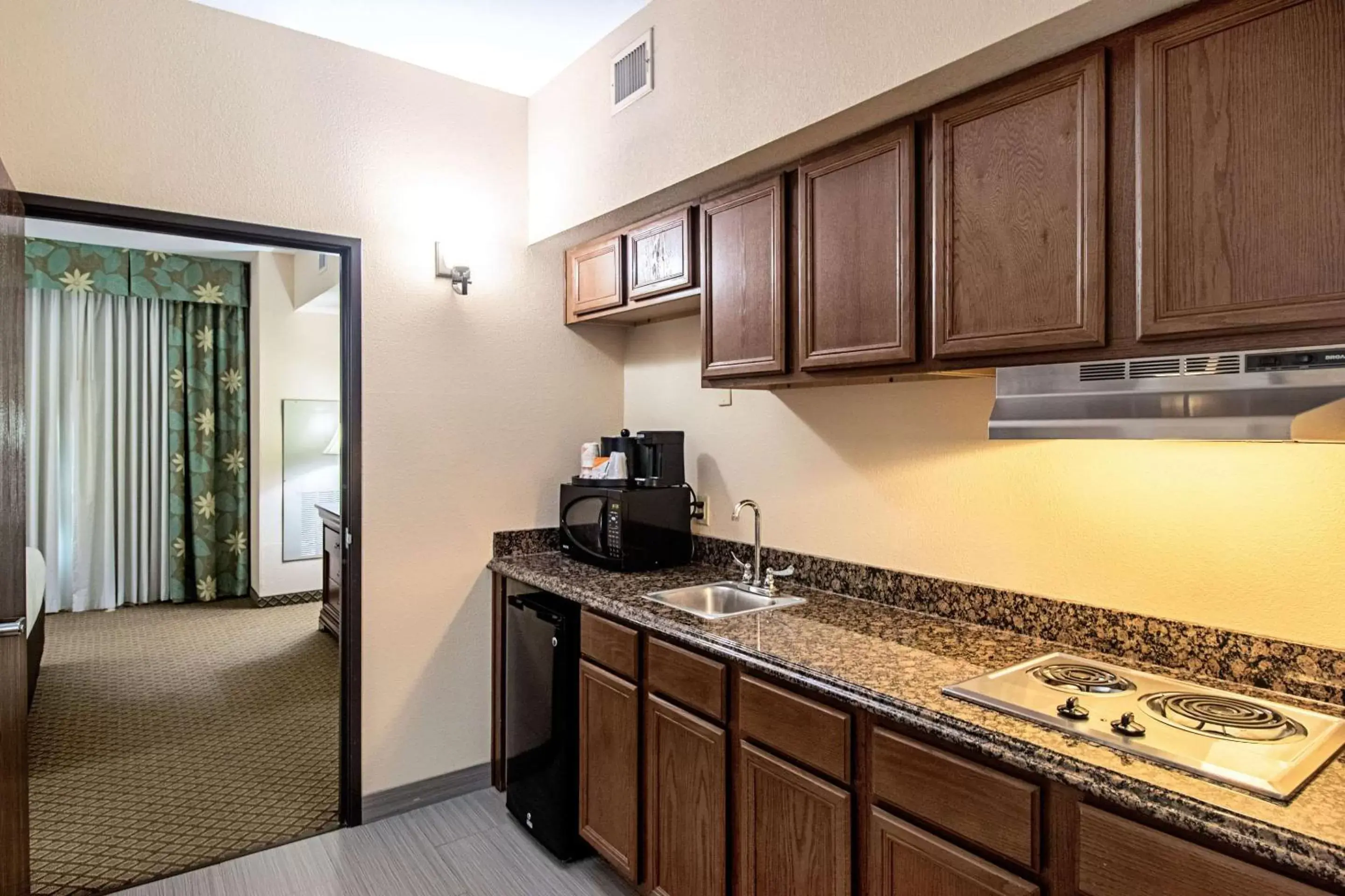 Bedroom, Kitchen/Kitchenette in Quality Inn & Suites