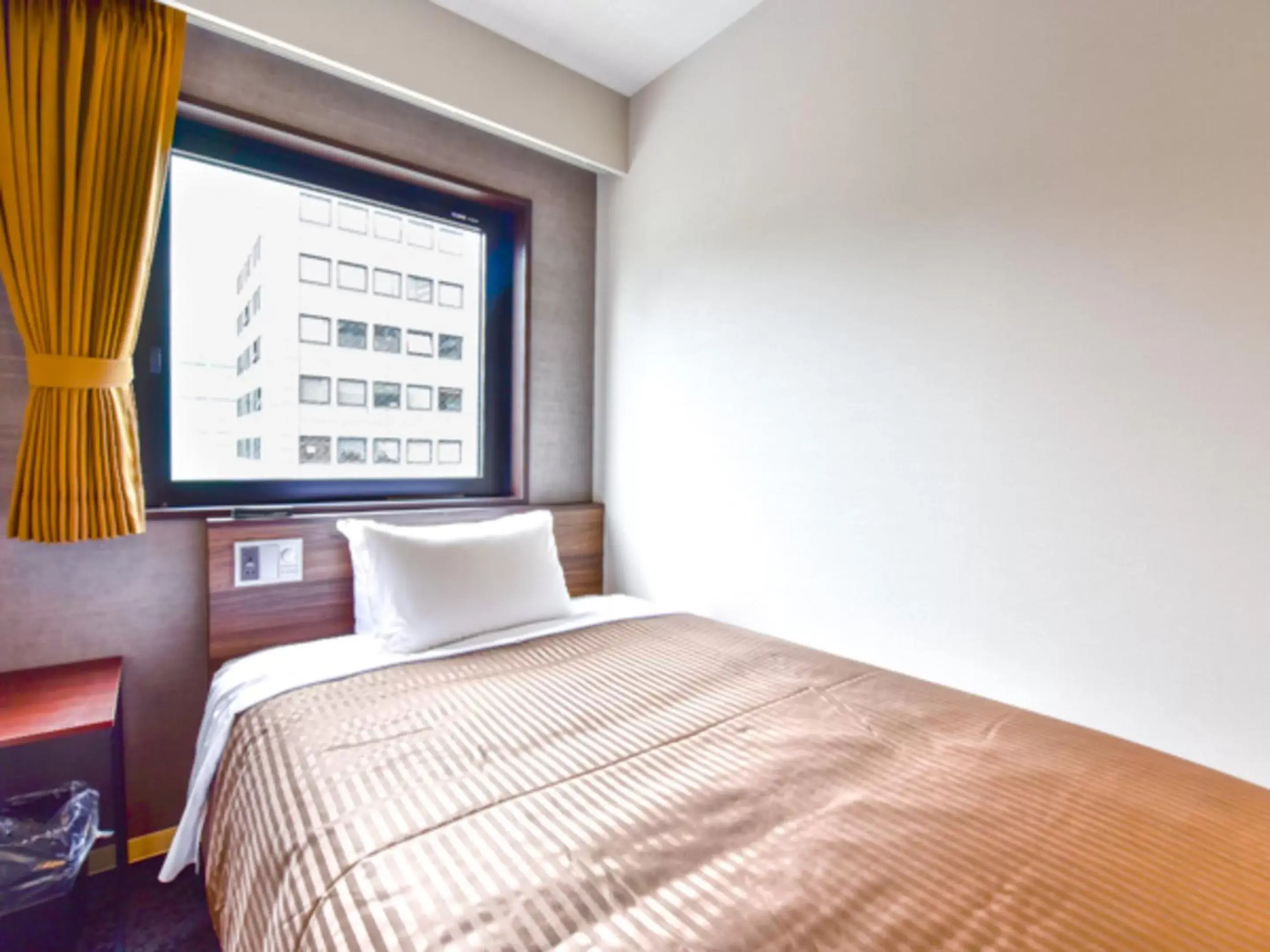 Bed in HOTEL LiVEMAX Fukuoka Tenjin West