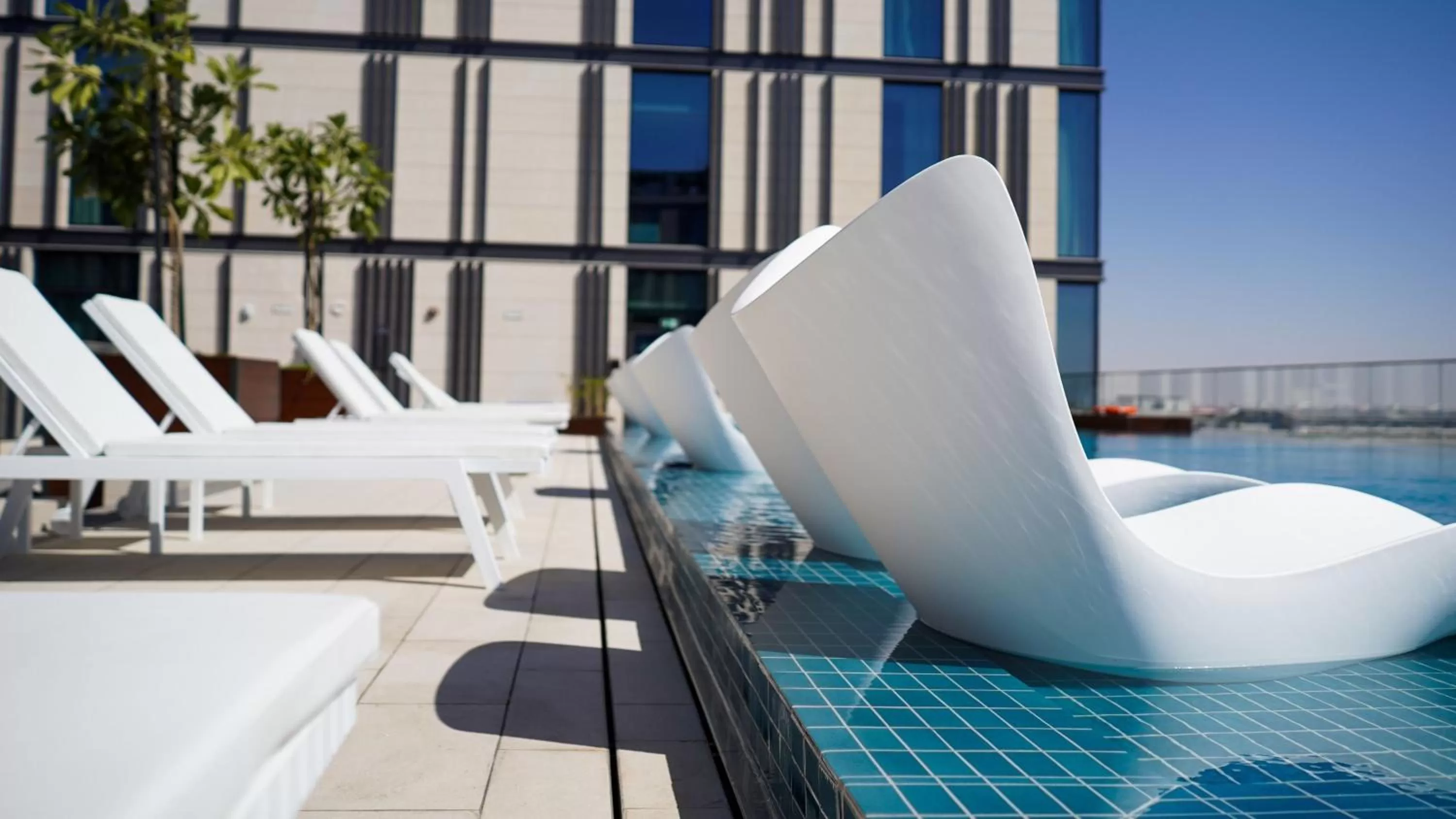 Swimming pool in Staybridge Suites Dubai Al-Maktoum Airport by IHG