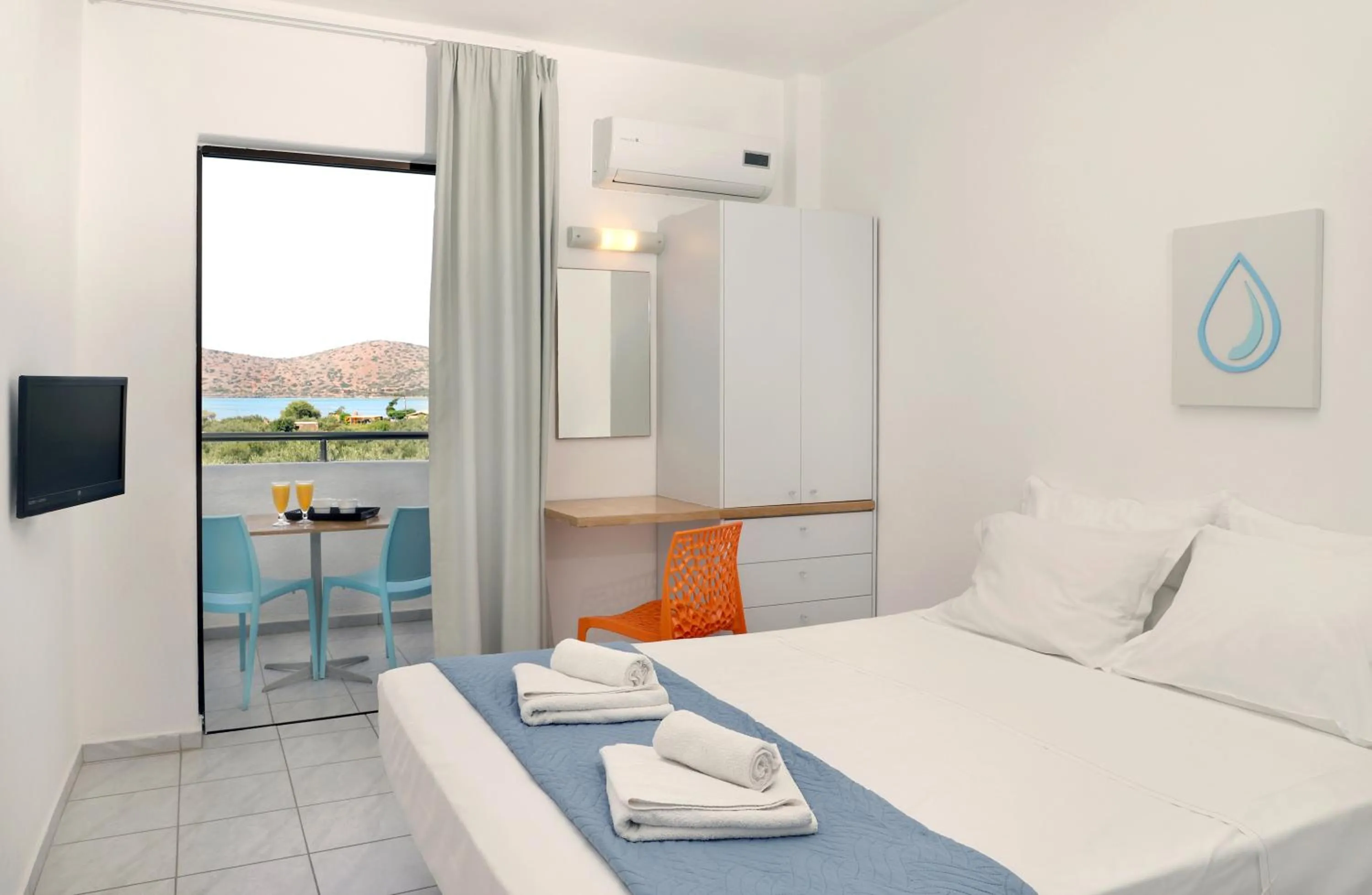 Photo of the whole room, Bed in Elounda Krini Hotel