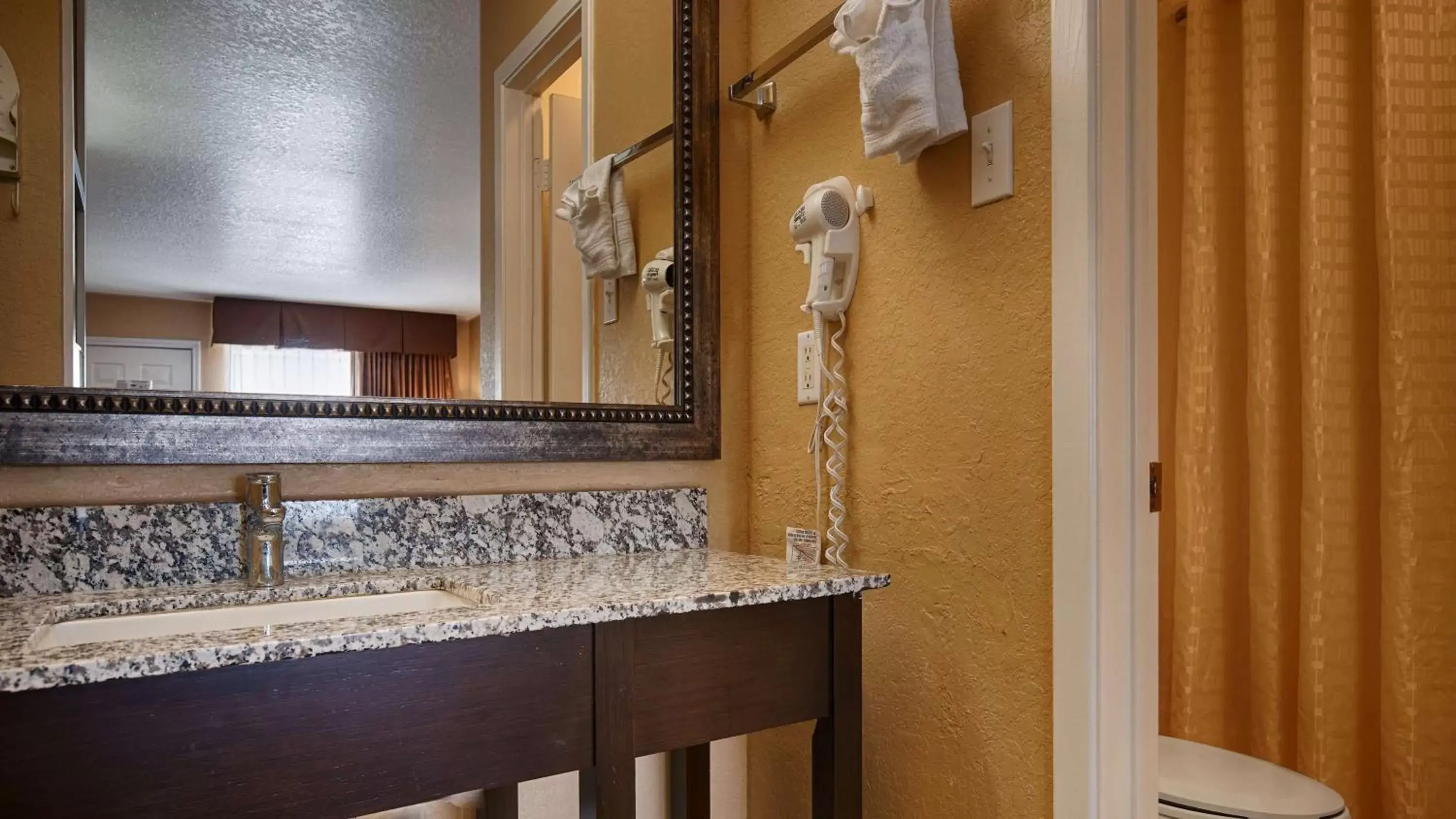 Bathroom in SureStay Hotel by Best Western Floresville