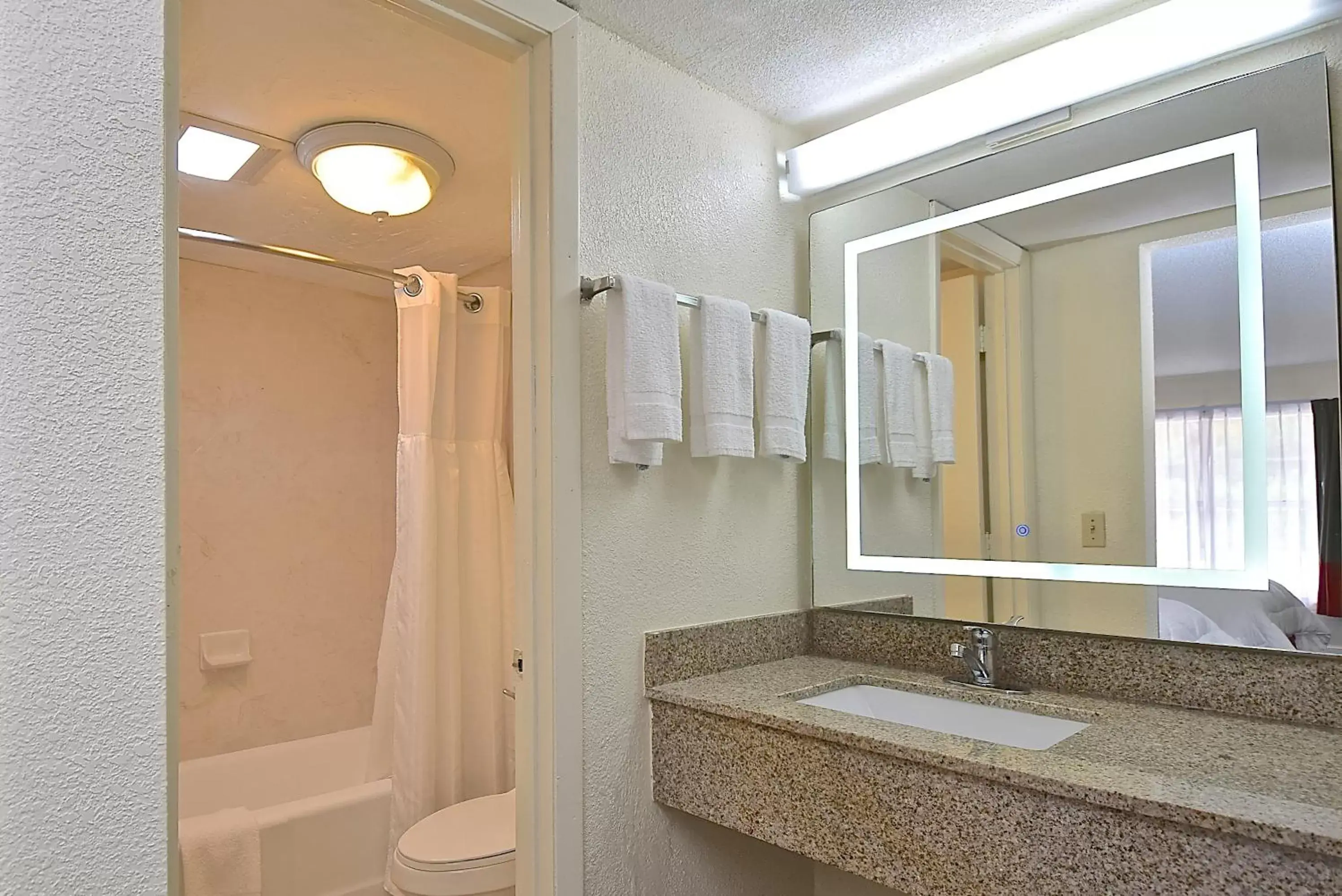 Bathroom in SureStay Hotel by Best Western Sarasota Lido Beach