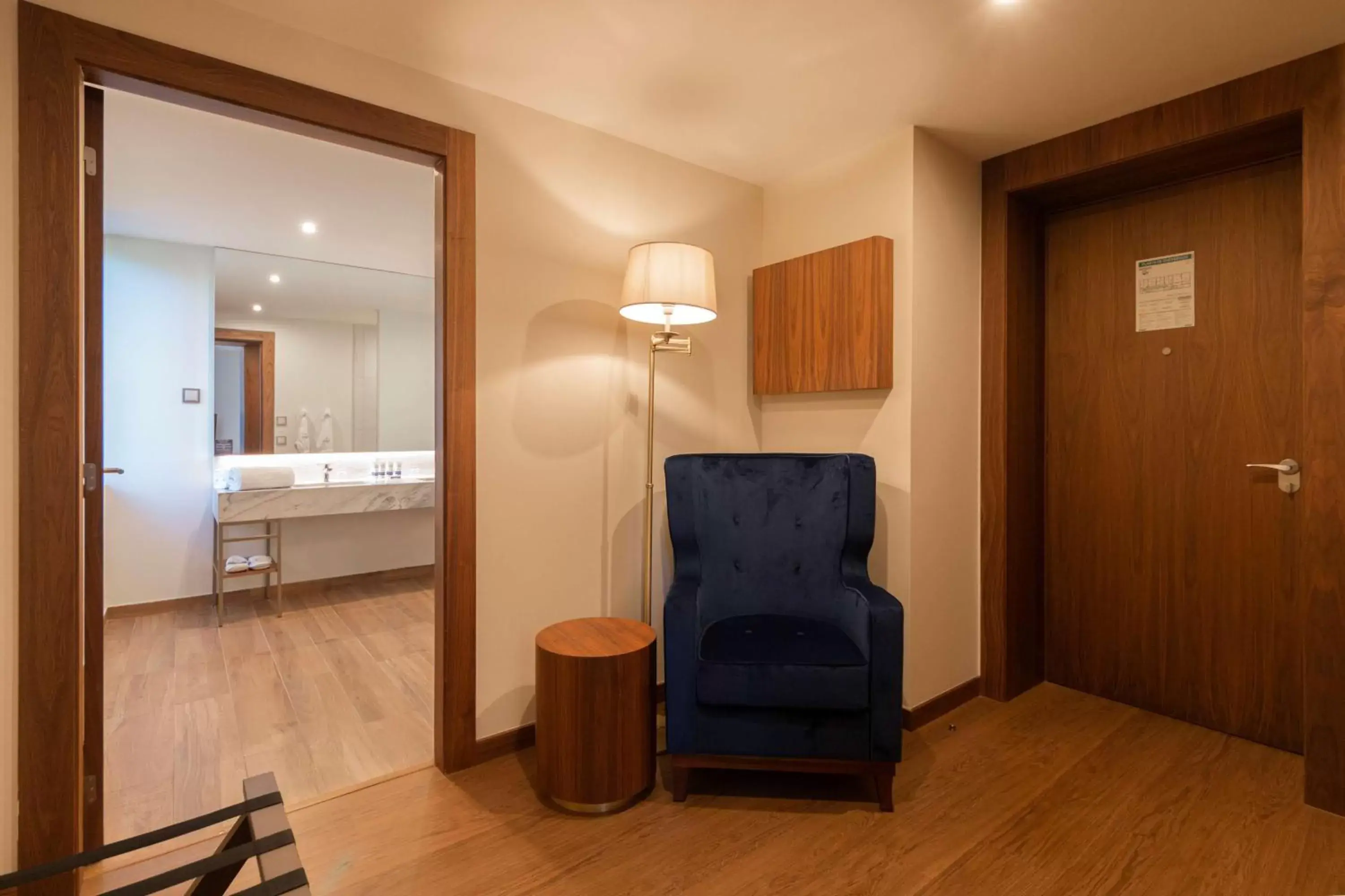 Living room, Bathroom in Boeira Garden Hotel Porto Gaia, Curio Collection by Hilton