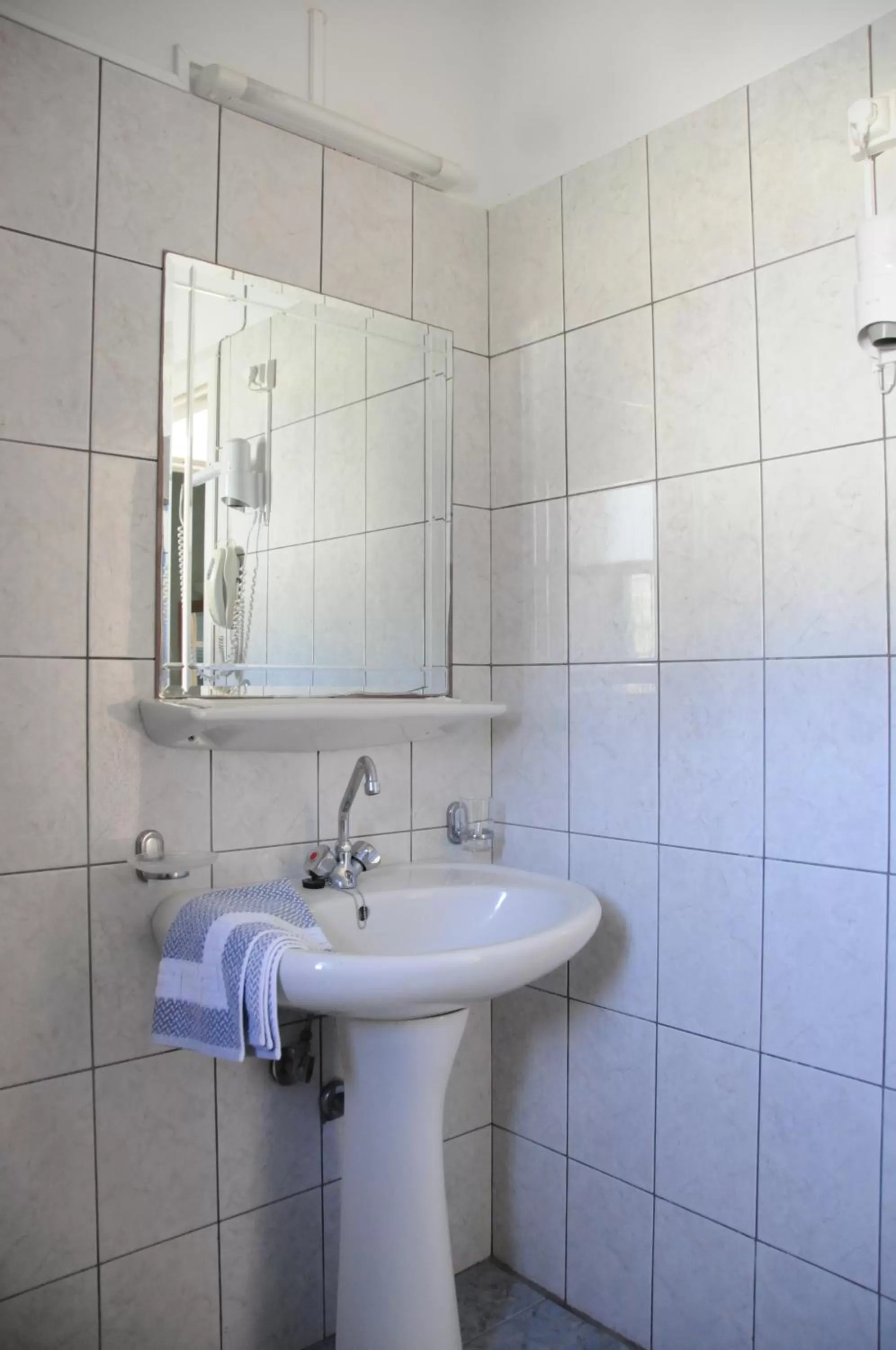 Bathroom in Costa-Rini Hotel