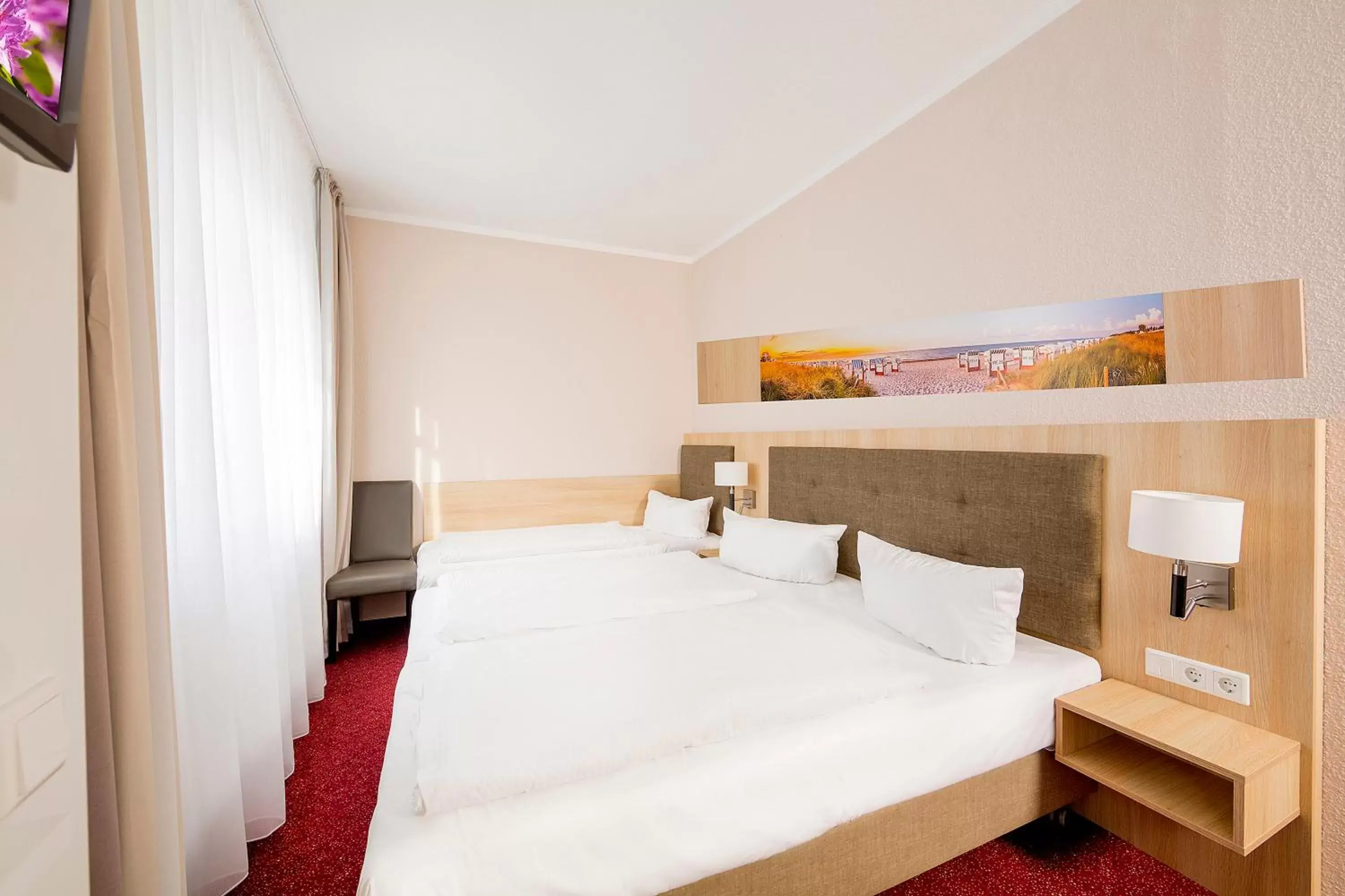 Bed in Garni Eden Hotels