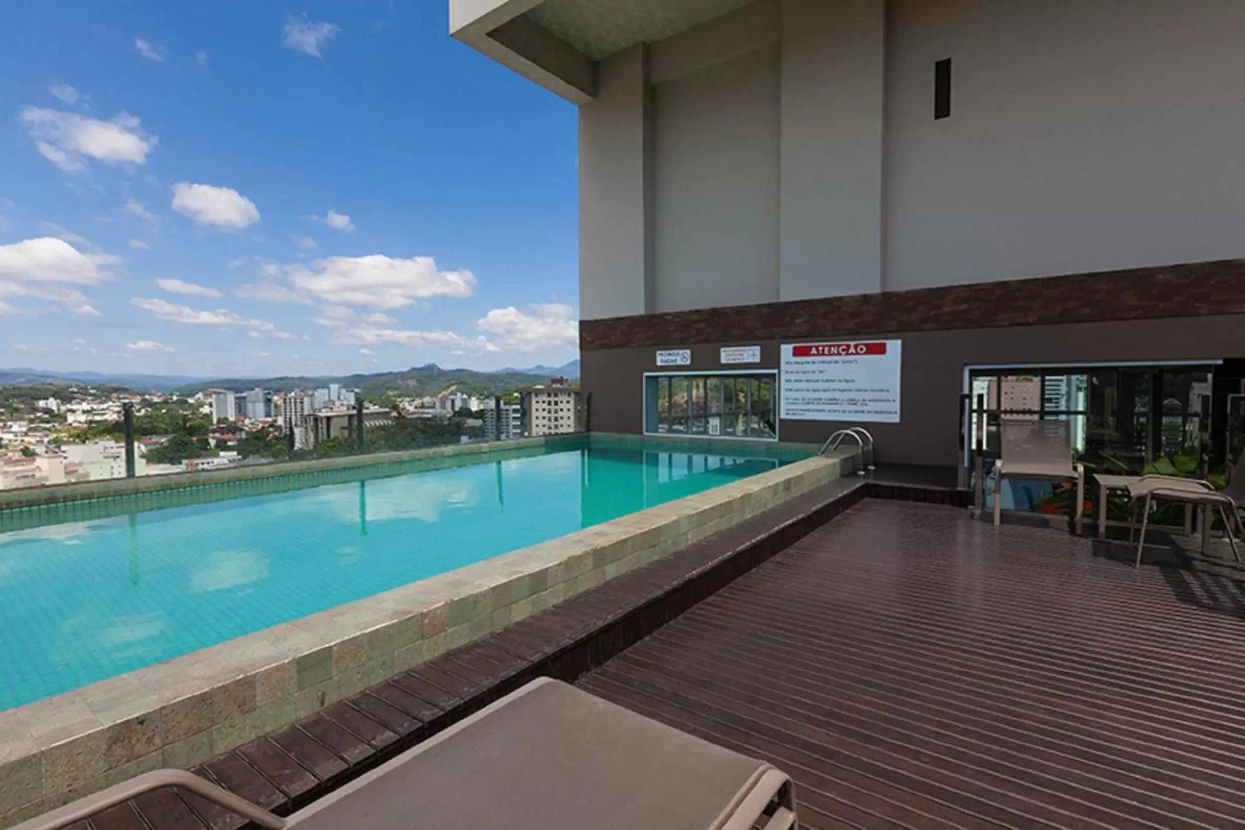 Balcony/Terrace, Swimming Pool in Tri Hotel Executive Brusque