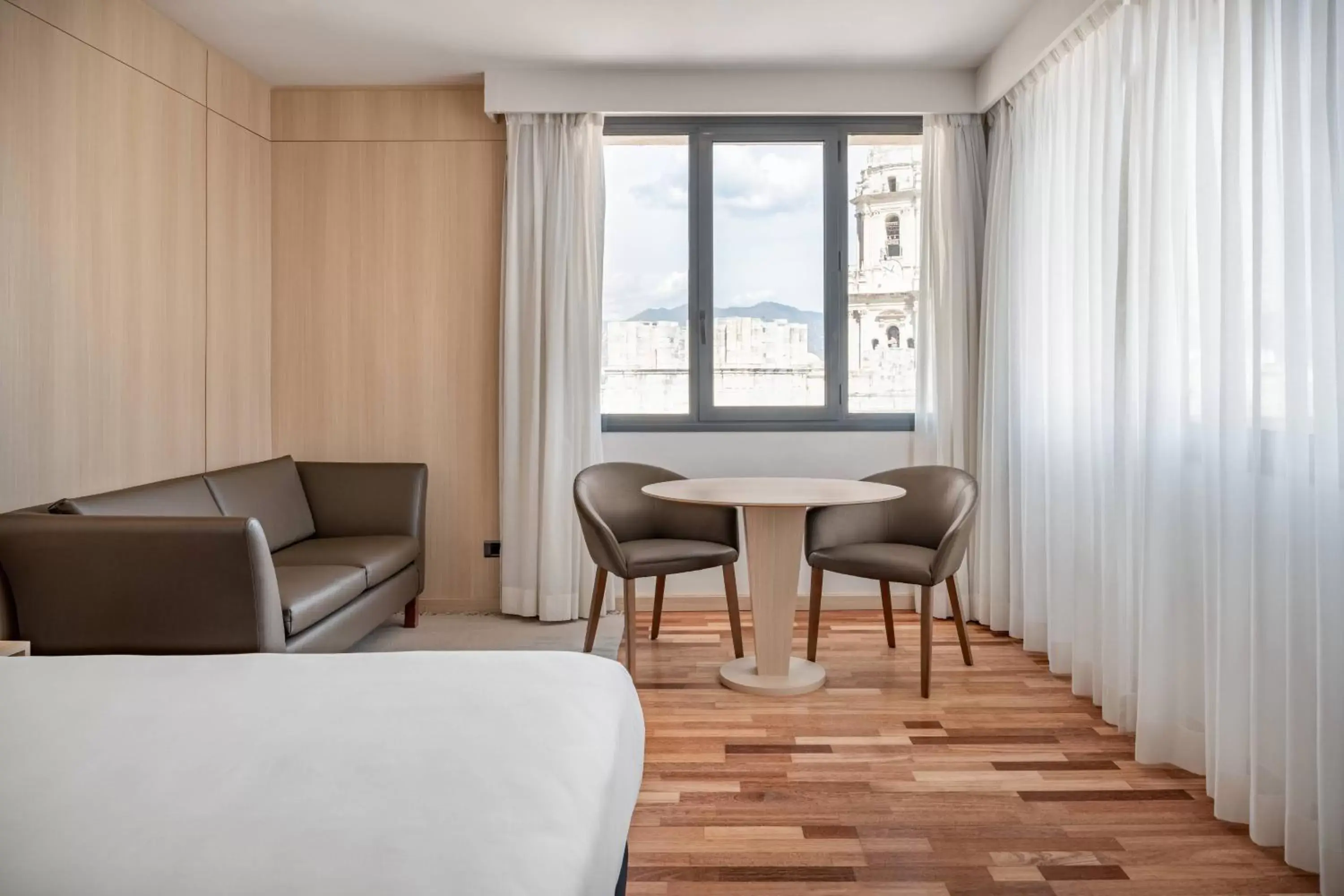 Photo of the whole room, Seating Area in AC Hotel Málaga Palacio by Marriott