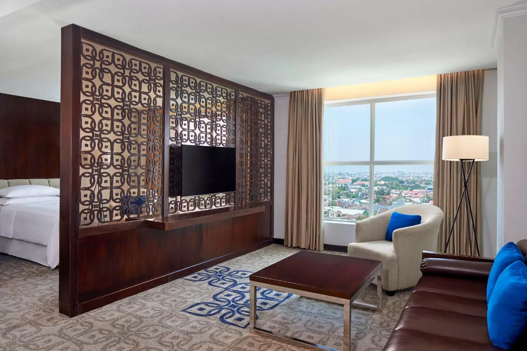 Bed, TV/Entertainment Center in Four Points by Sheraton Makassar