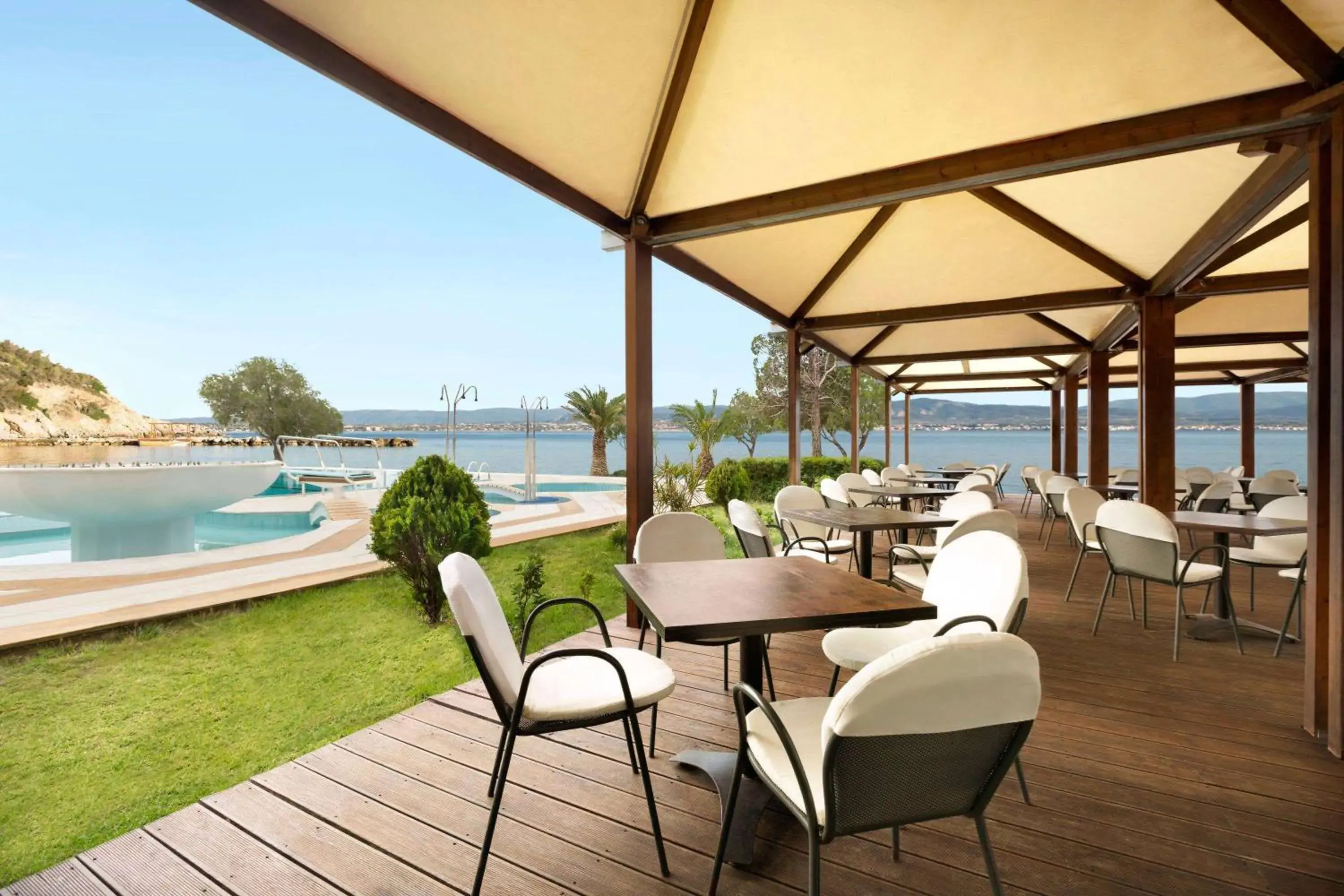 Pool view in Ramada Loutraki Poseidon Resort Pool view in Ramada Loutraki Poseidon Resort