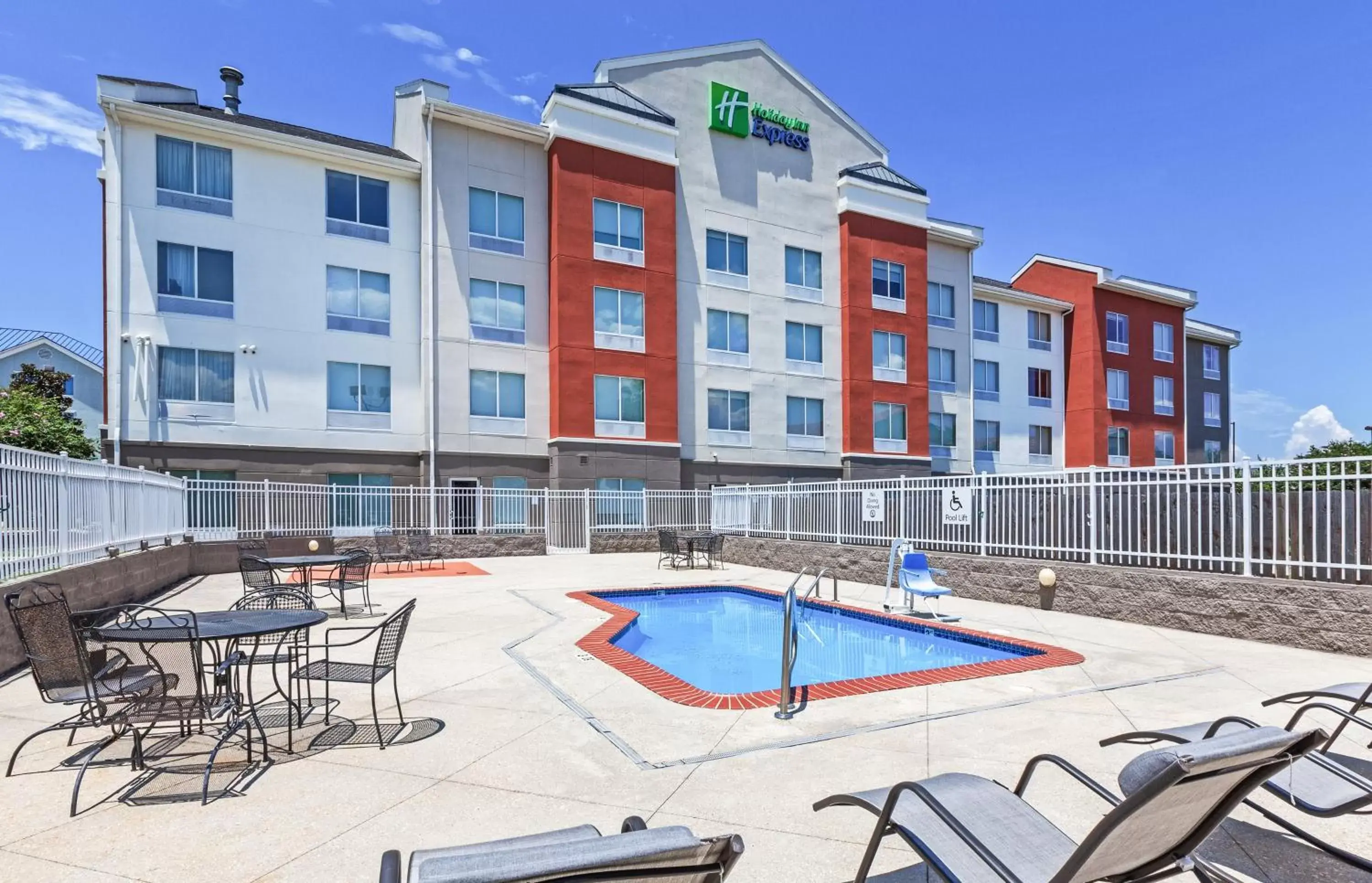 Swimming pool, Property Building in Holiday Inn Express New Orleans East, an IHG Hotel