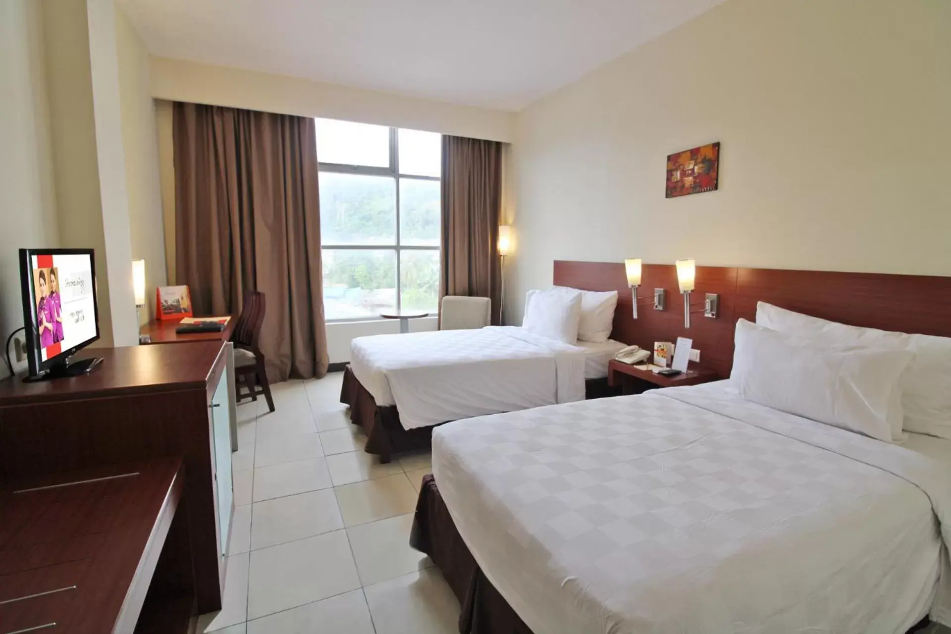 Bed in Swiss-Belhotel Manokwari