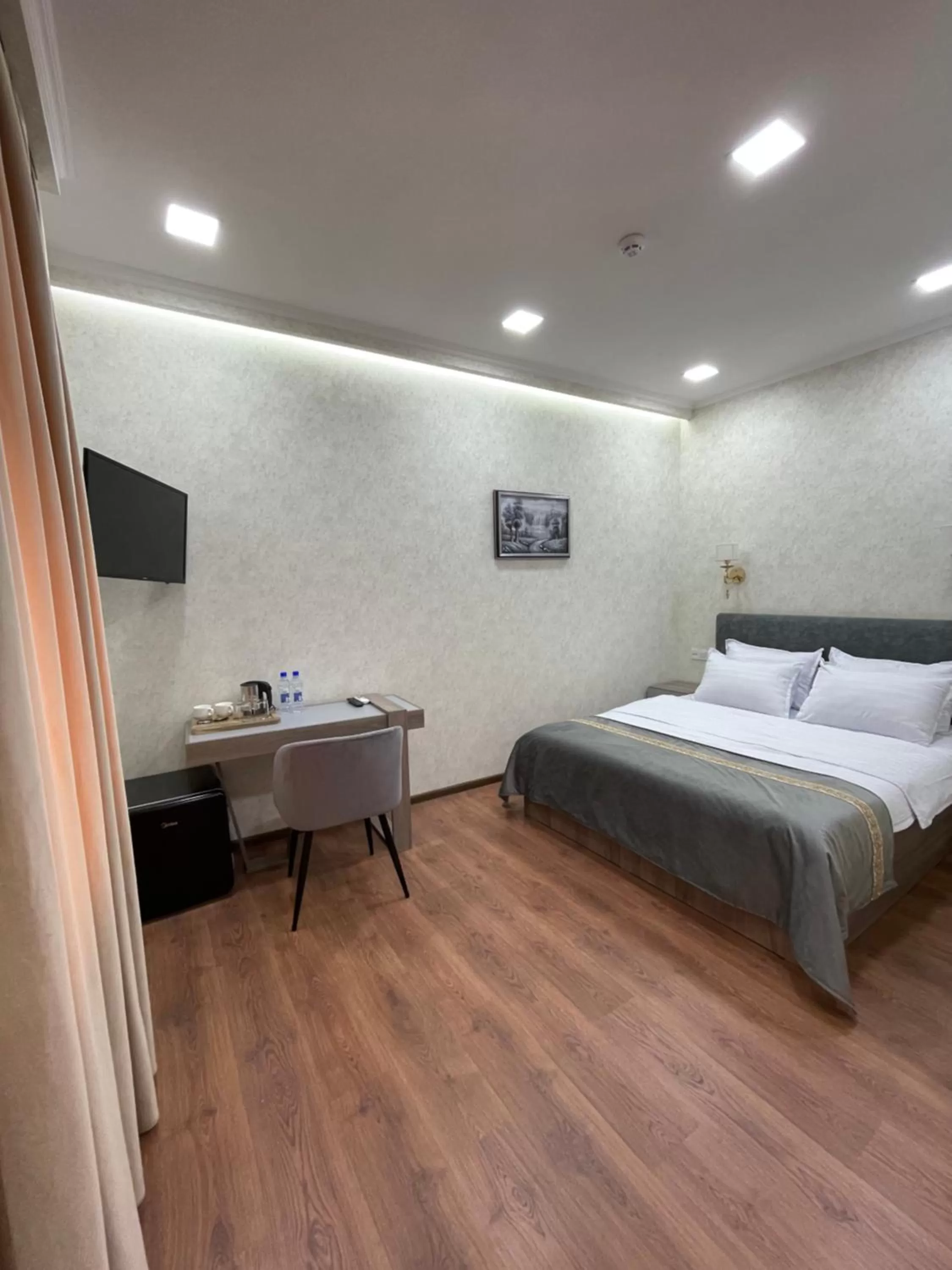 Bed in Registon Saroy Hotel