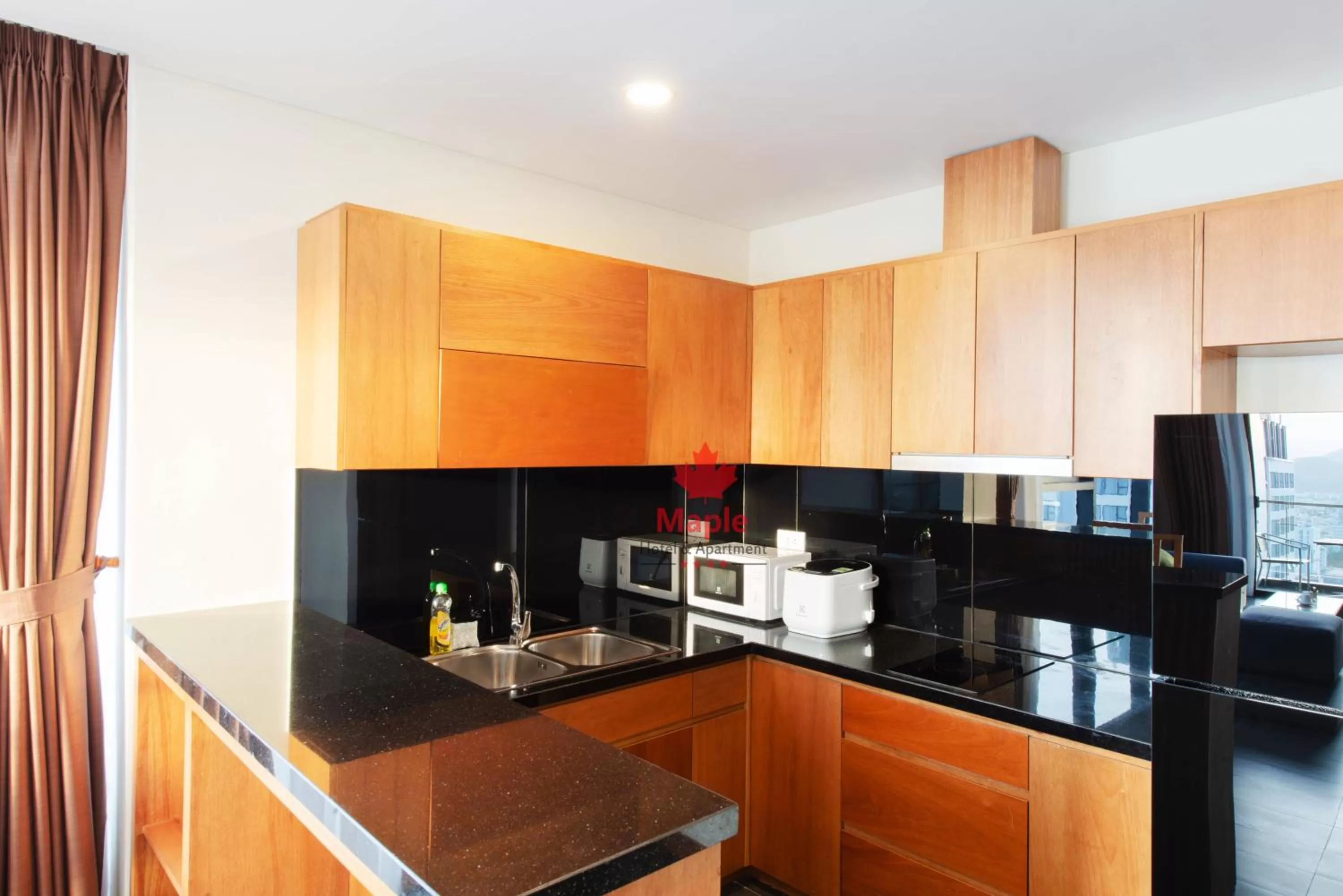 Kitchen or kitchenette in Maple Hotel & Apartment