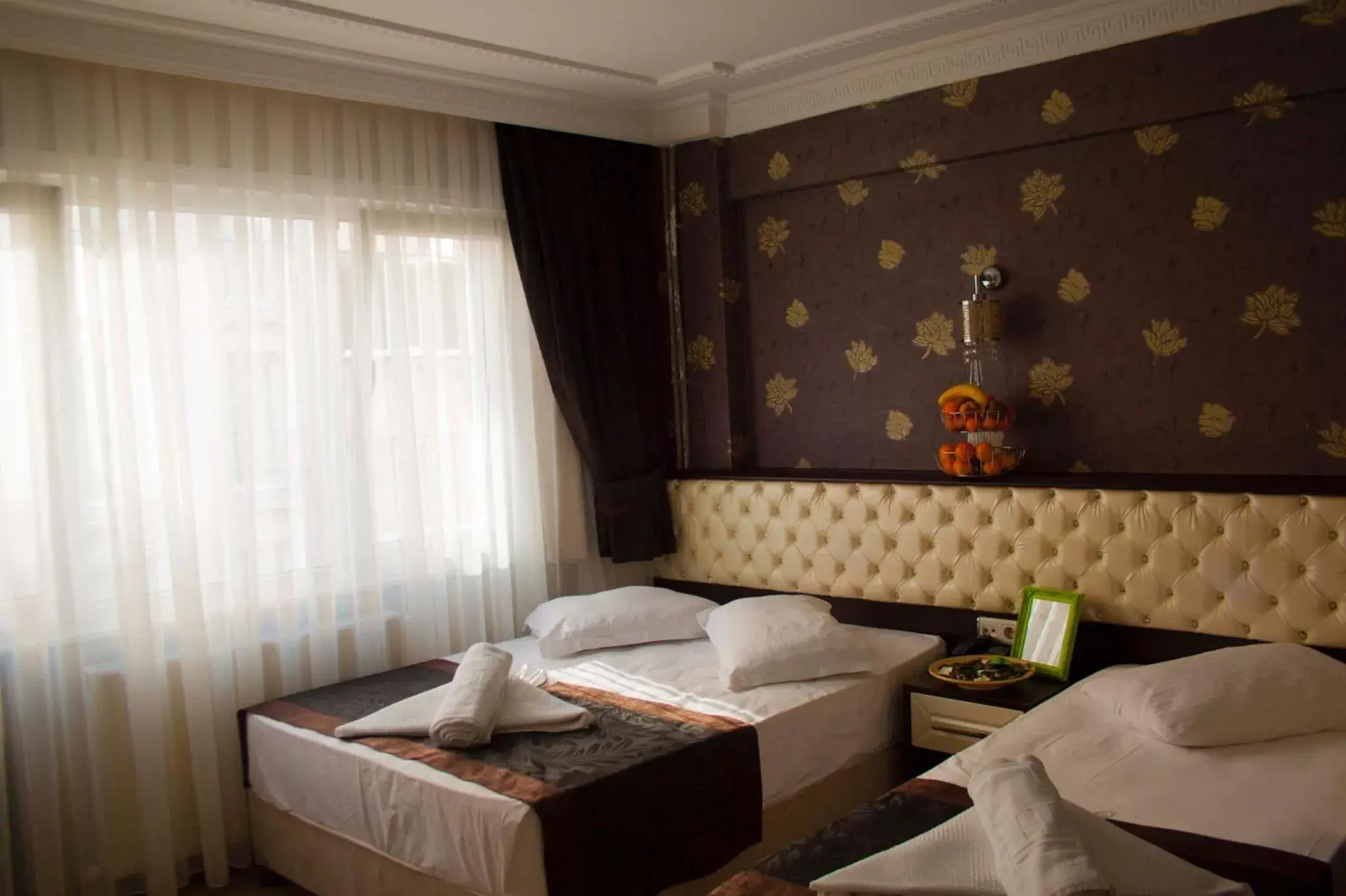 Bed in Grand Esen Hotel