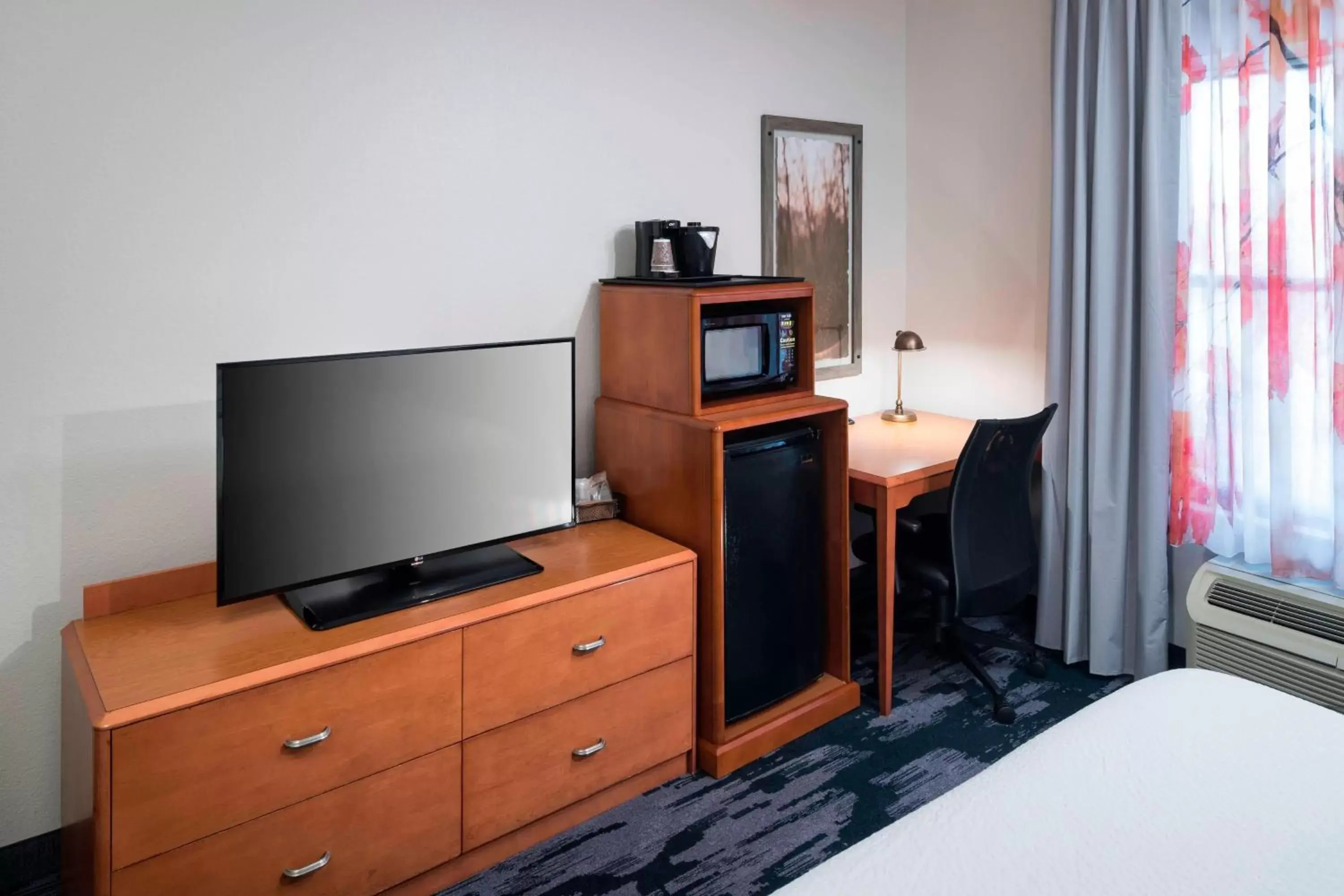 Photo of the whole room, TV/Entertainment Center in Fairfield Inn Suites by Marriott Orlando At SeaWorld