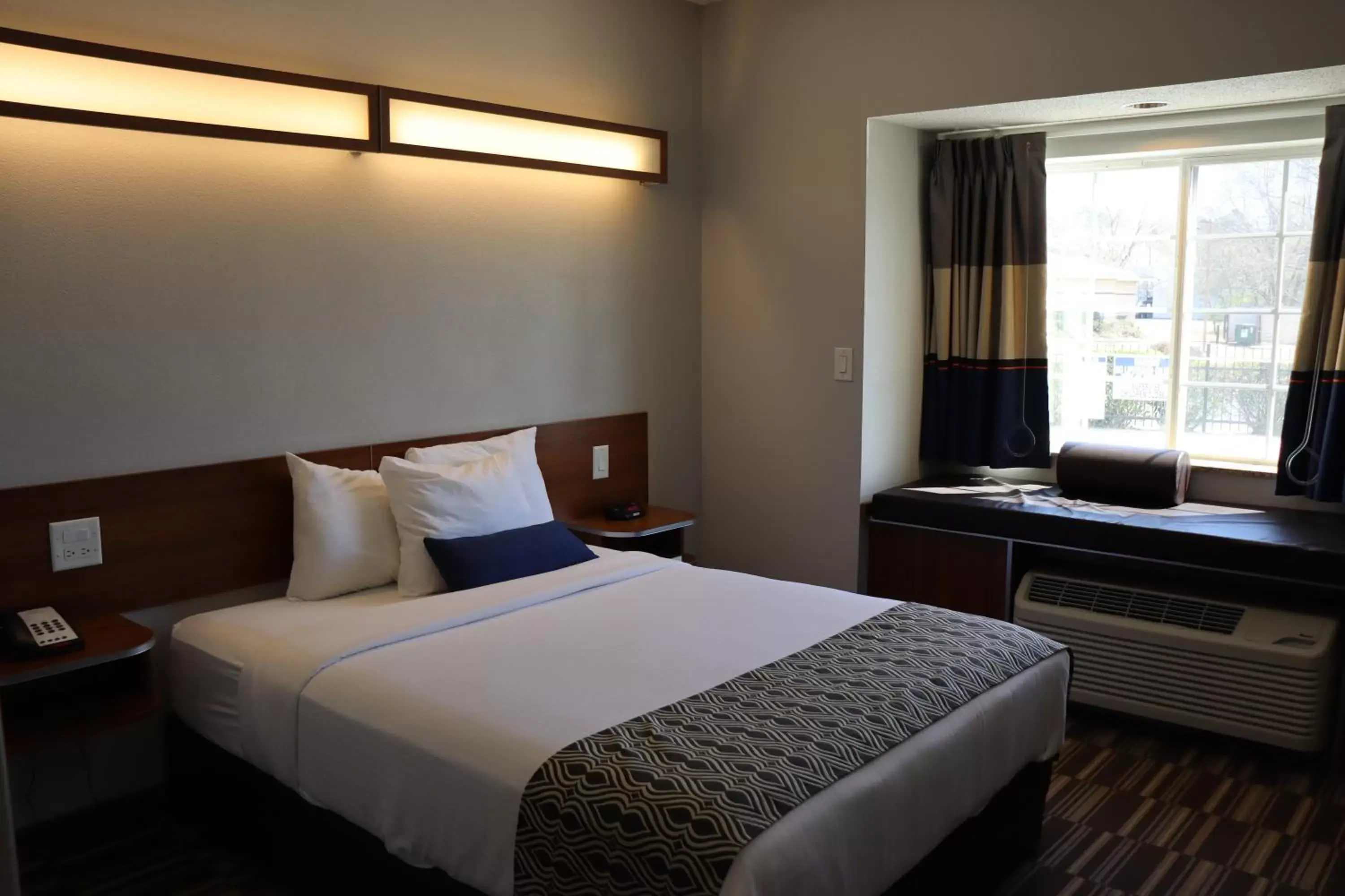 Bed in Microtel Inn & Suites by Wyndham Columbus Near Fort Moore