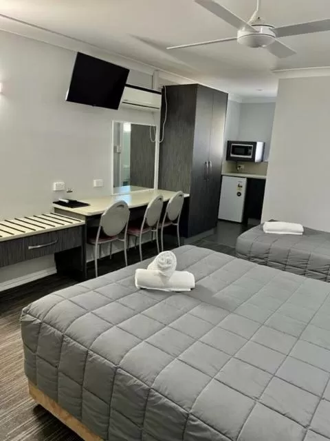 Bed in Forster Palms Motel