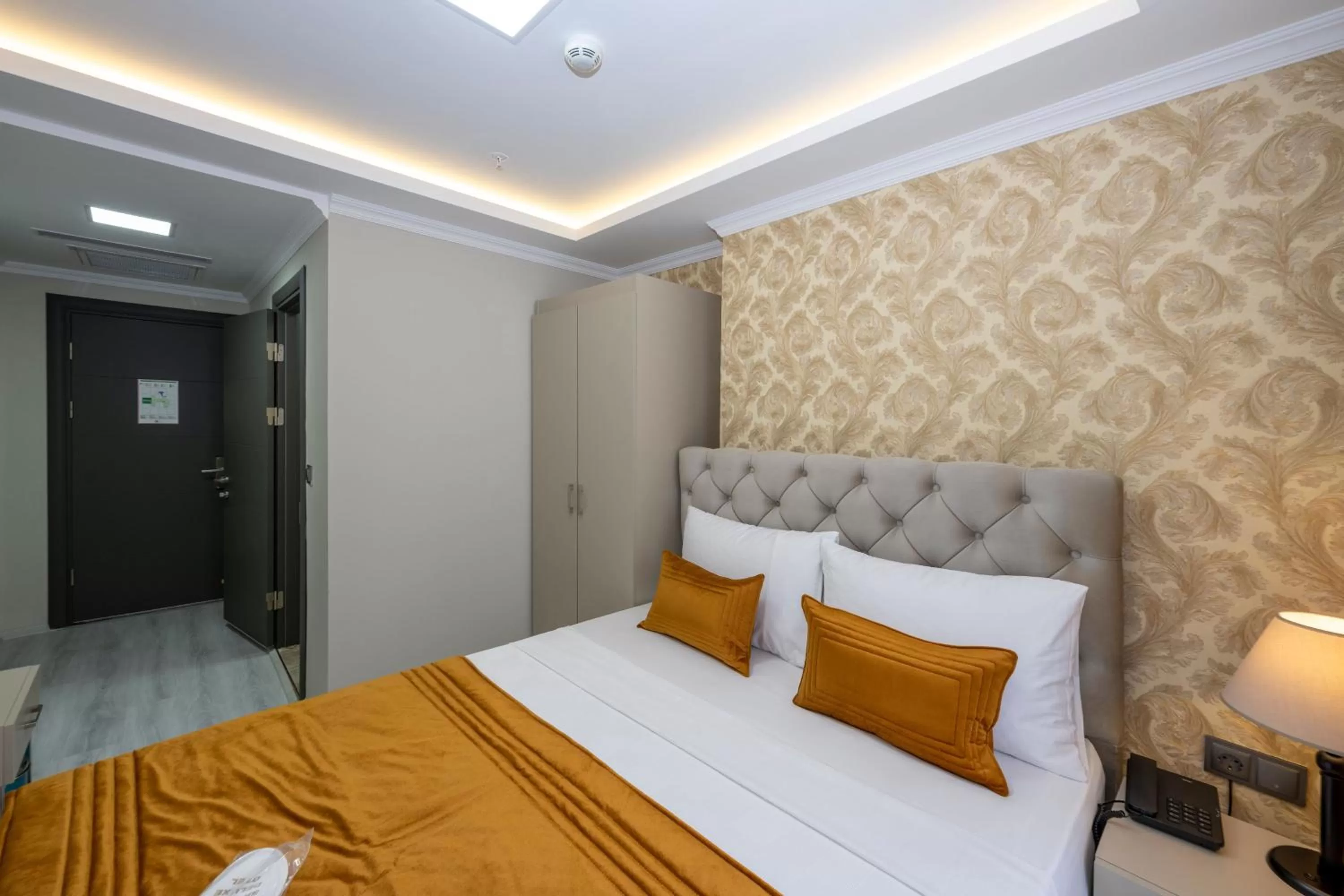 Bed in SKYSTAR DELUXE HOTEL