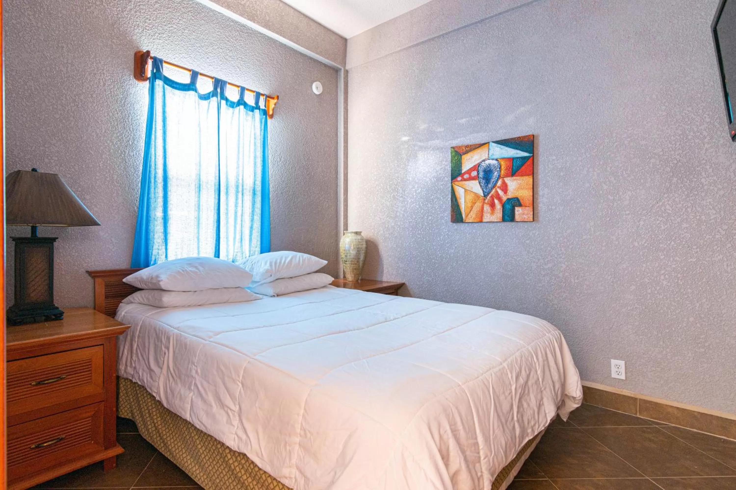 Bed in Lighthouse Beach Villas