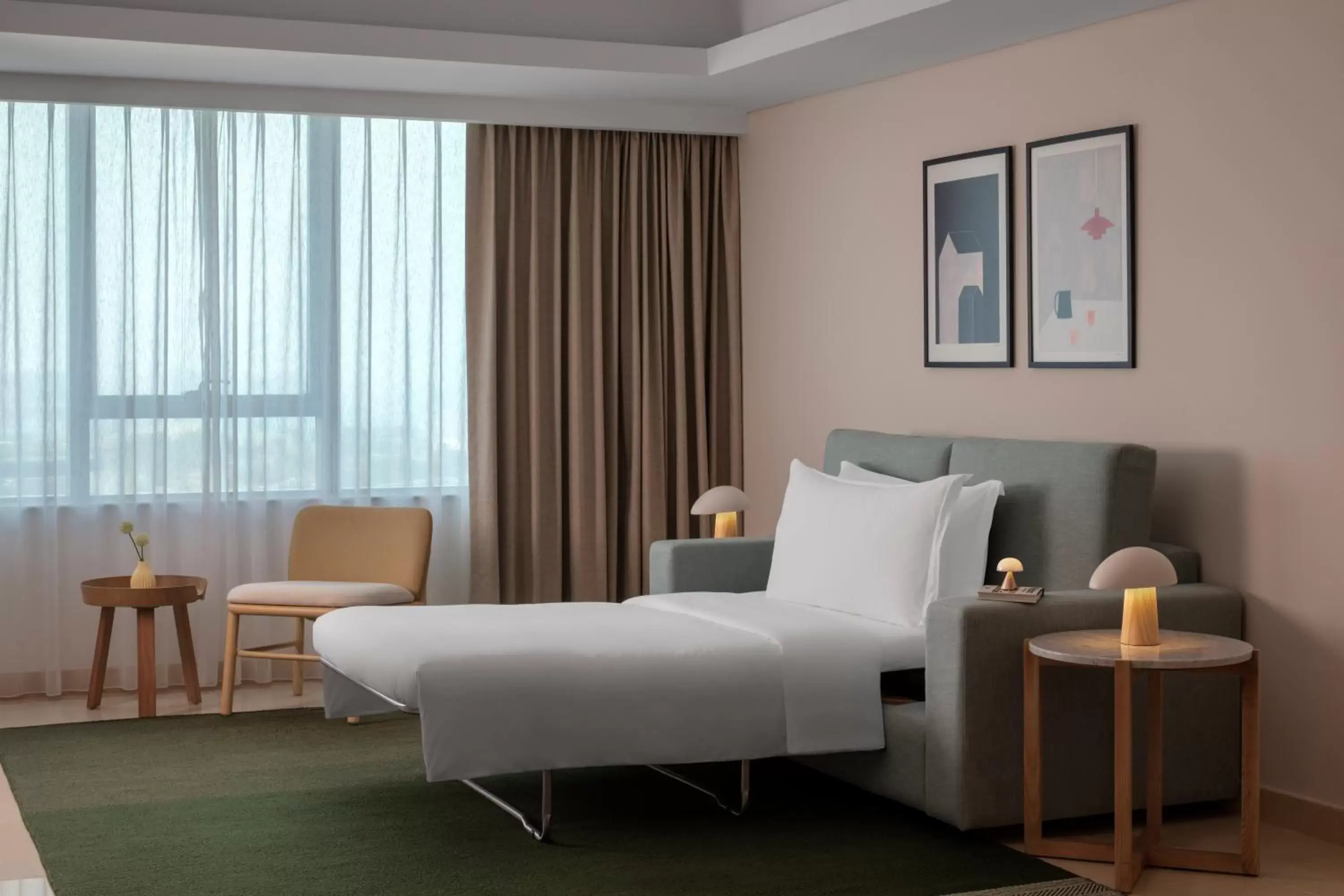 Bedroom, Seating Area in Staybridge Suites Dubai Internet City, an IHG Hotel