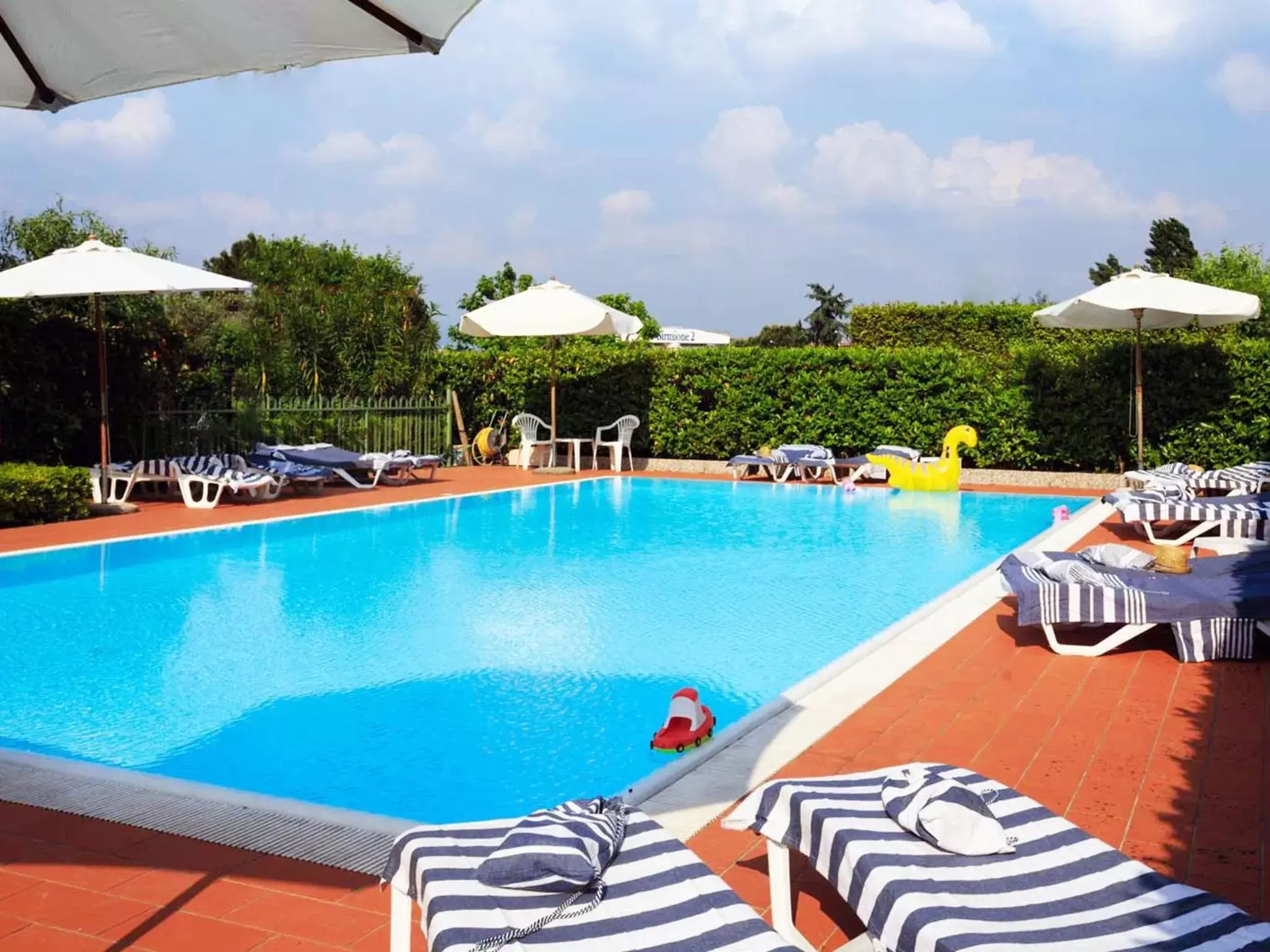 Day, Swimming Pool in BellaSirmione Holiday Apartments