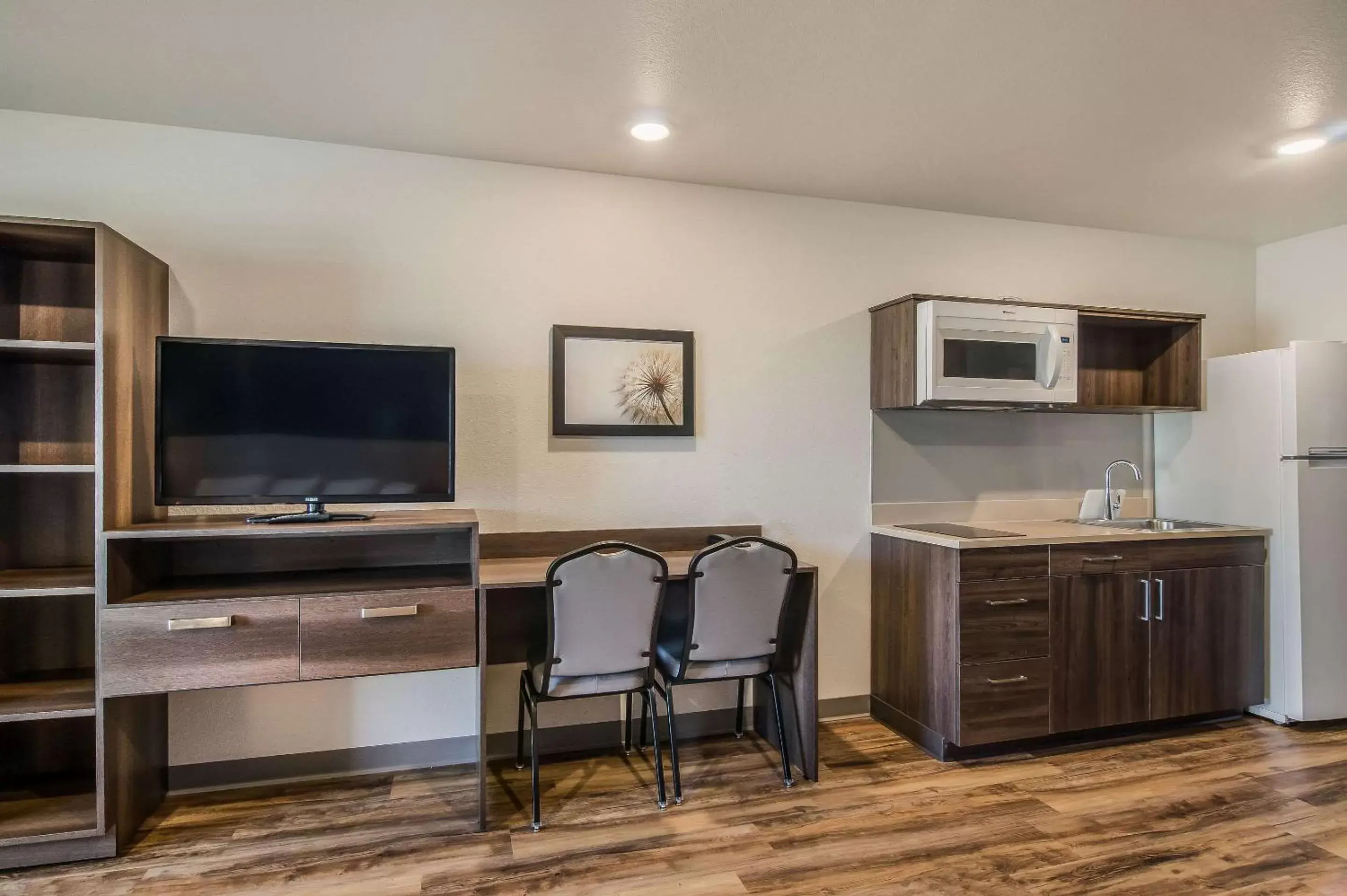 Photo of the whole room, TV/Entertainment Center in WoodSpring Suites Broomfield-Westminster