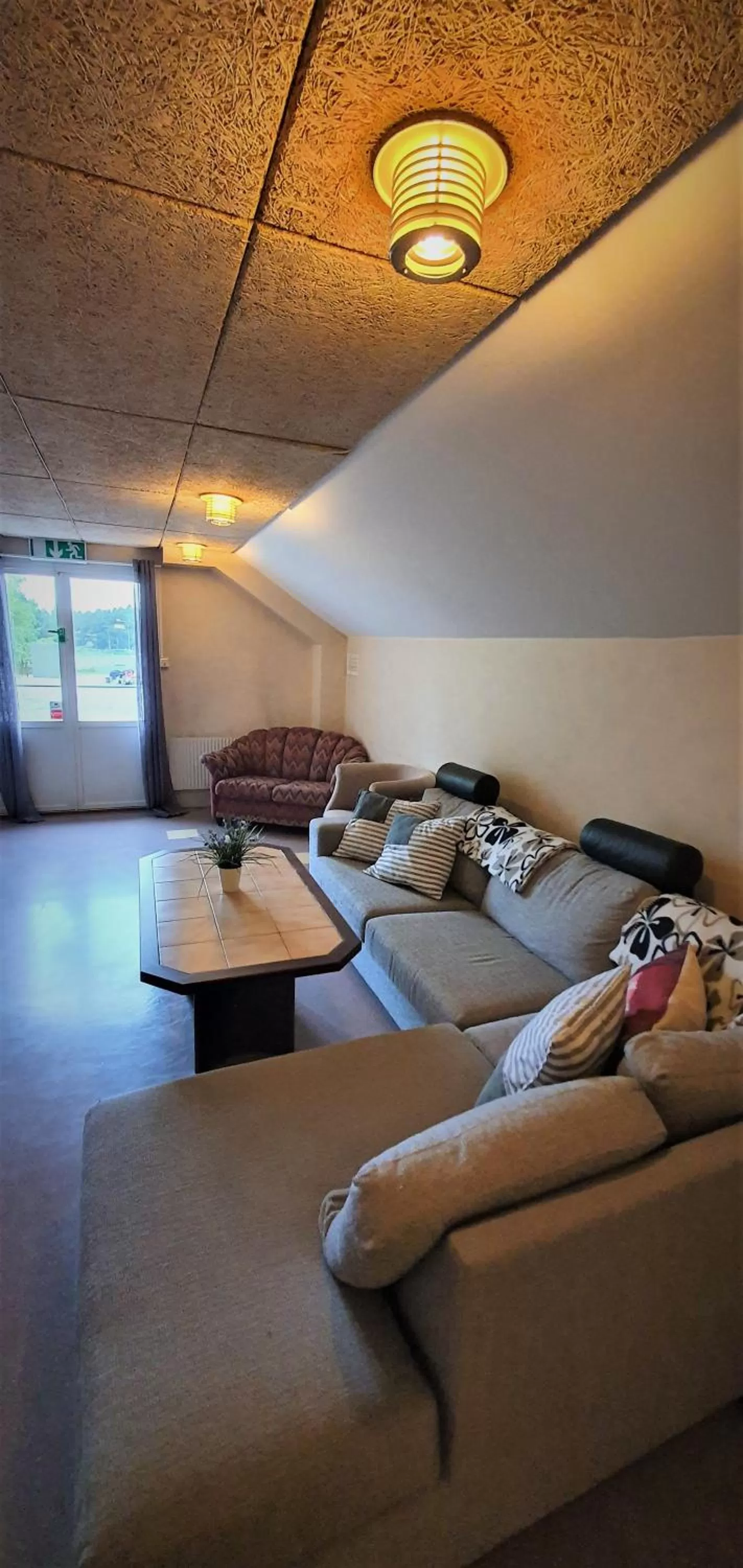 Seating area, Bed in Nipanhotellet