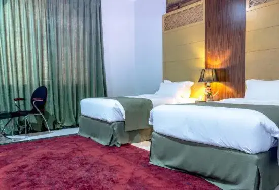 Bed in Doha Dynasty Hotel