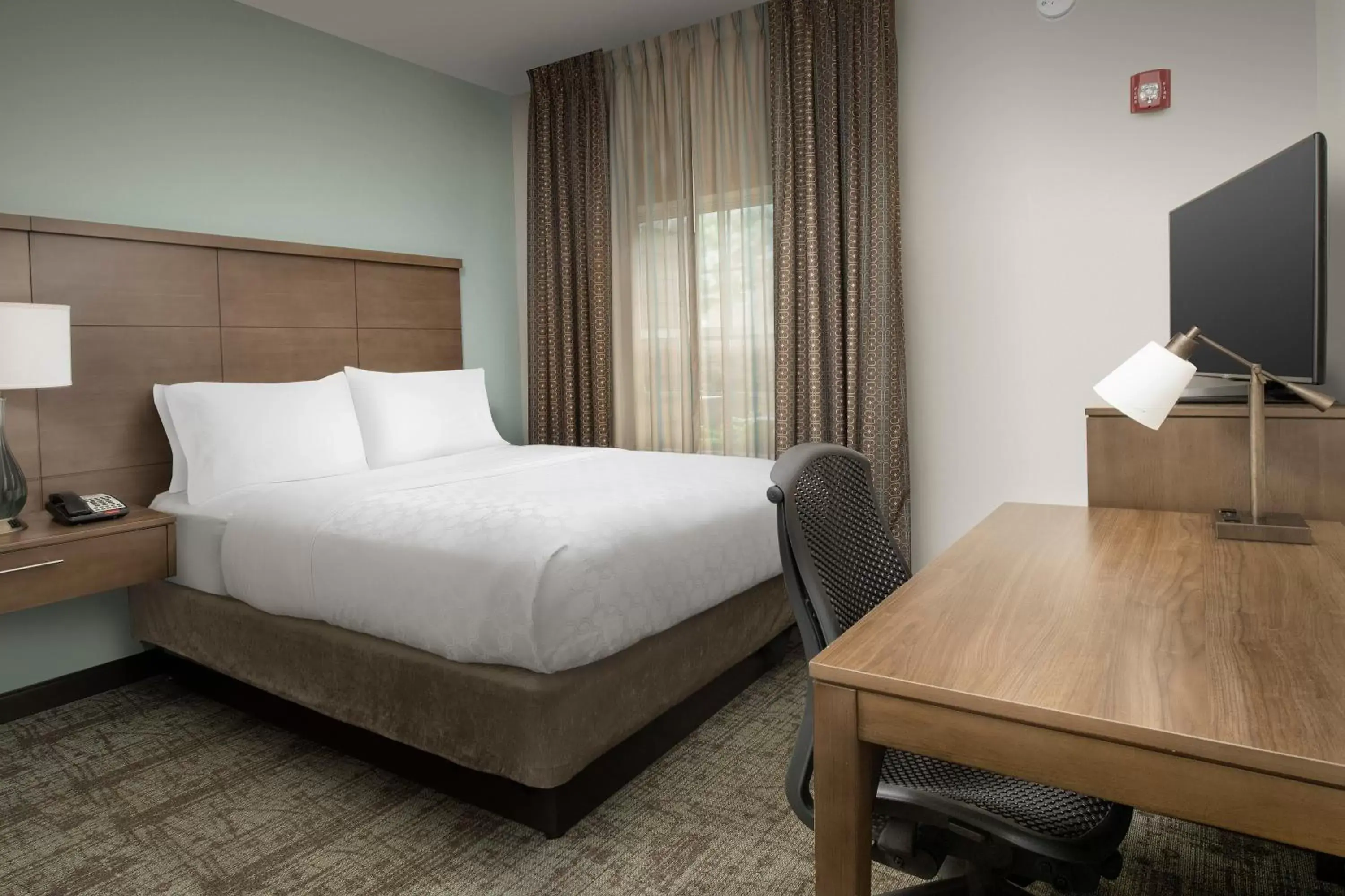 TV and multimedia, Bed in Staybridge Suites Greenville I-85 Woodruff Road, an IHG Hotel
