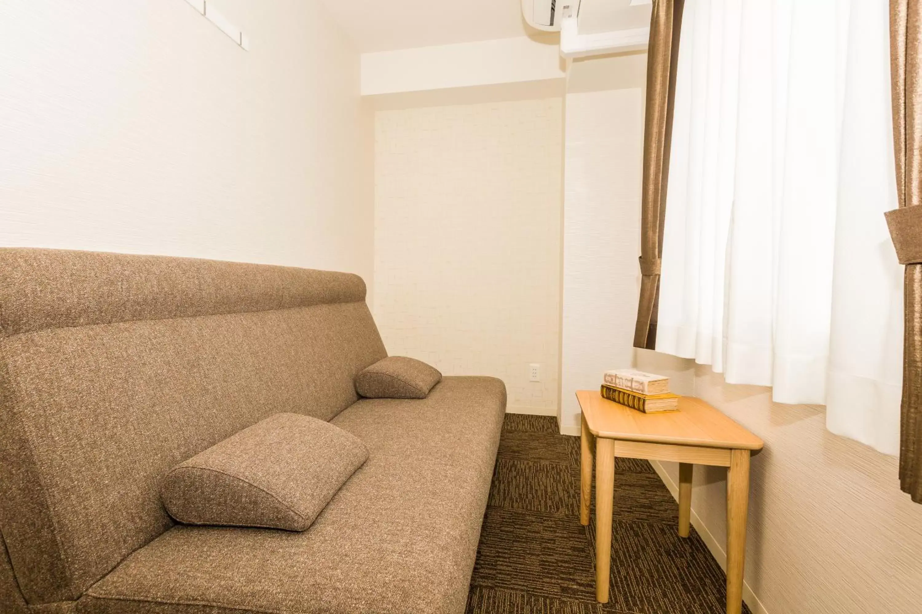 Photo of the whole room, Seating Area in Hotel Ninestates Hakata