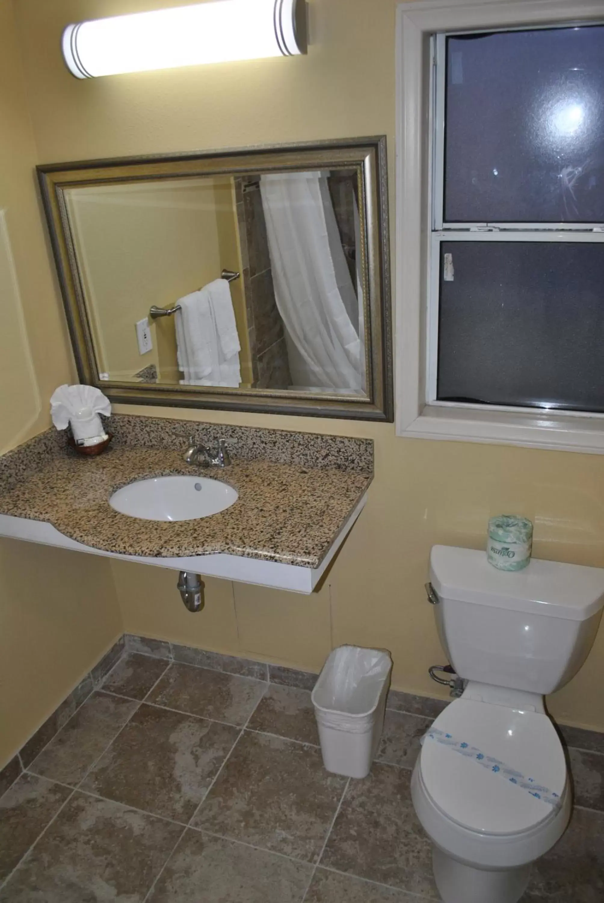 Bathroom in Oasis Inn and Suites