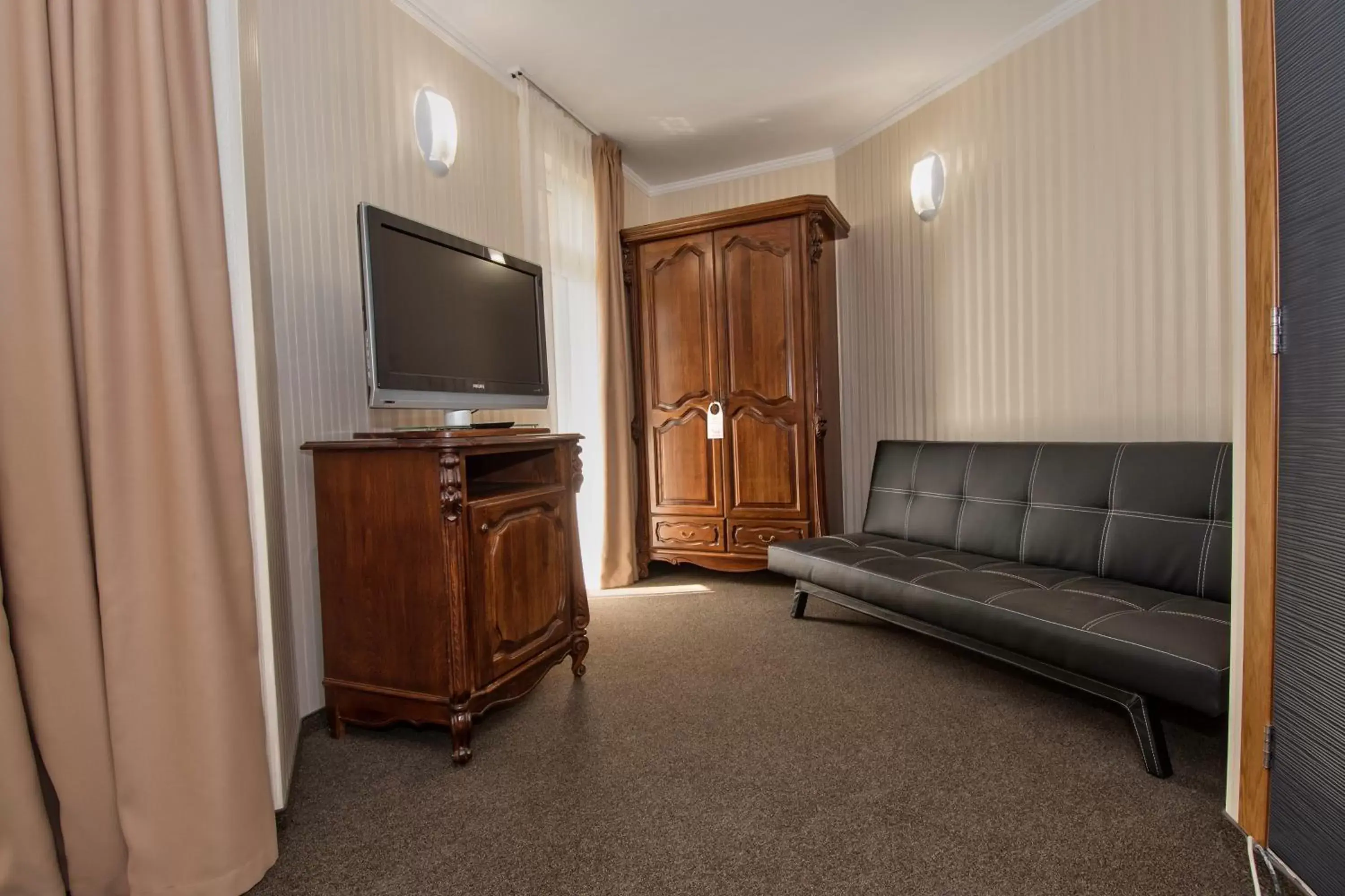 Photo of the whole room, TV/Entertainment Center in Hotel Perfect